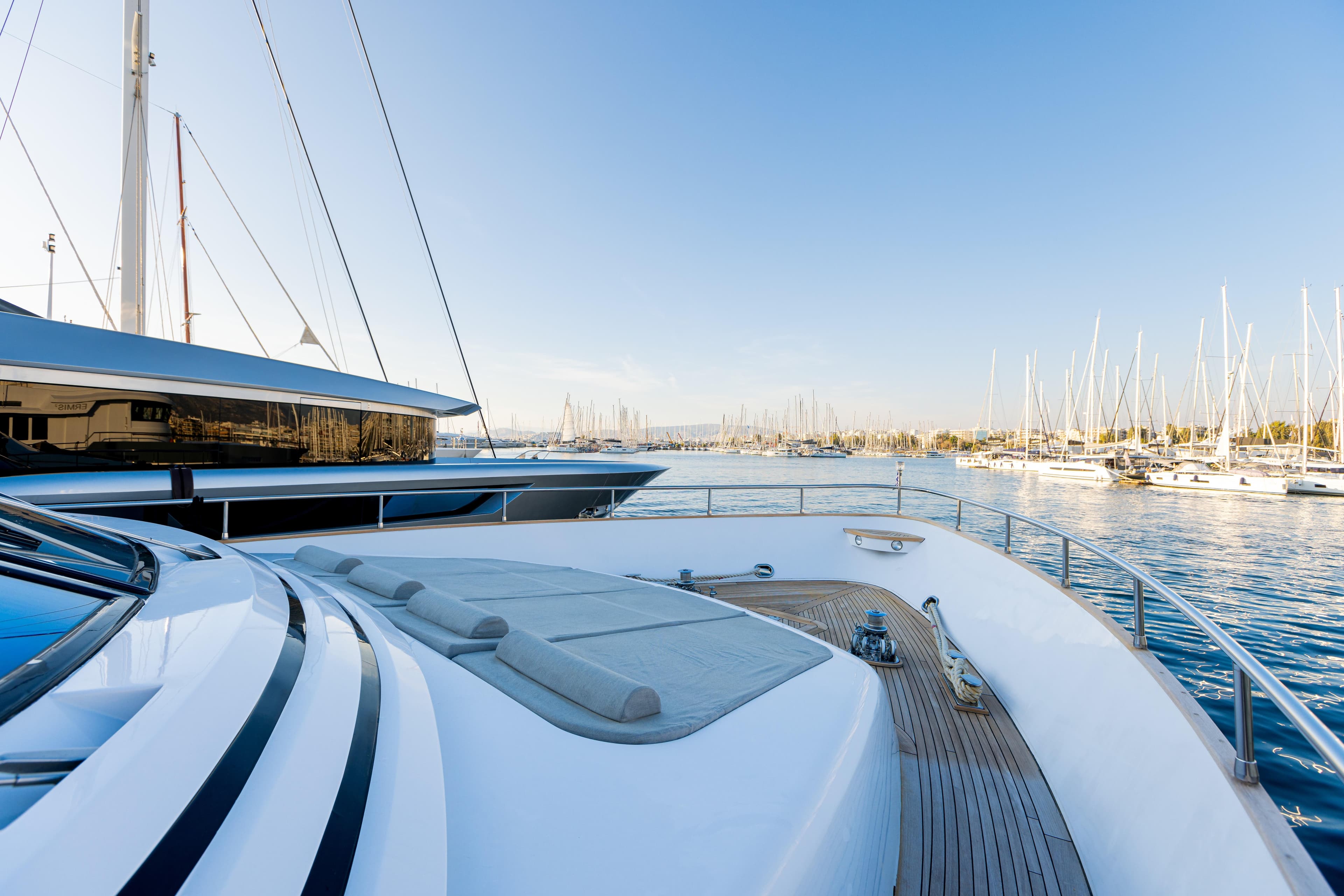 Luxury yacht Diano 26 from 1999 in sunny harbor.