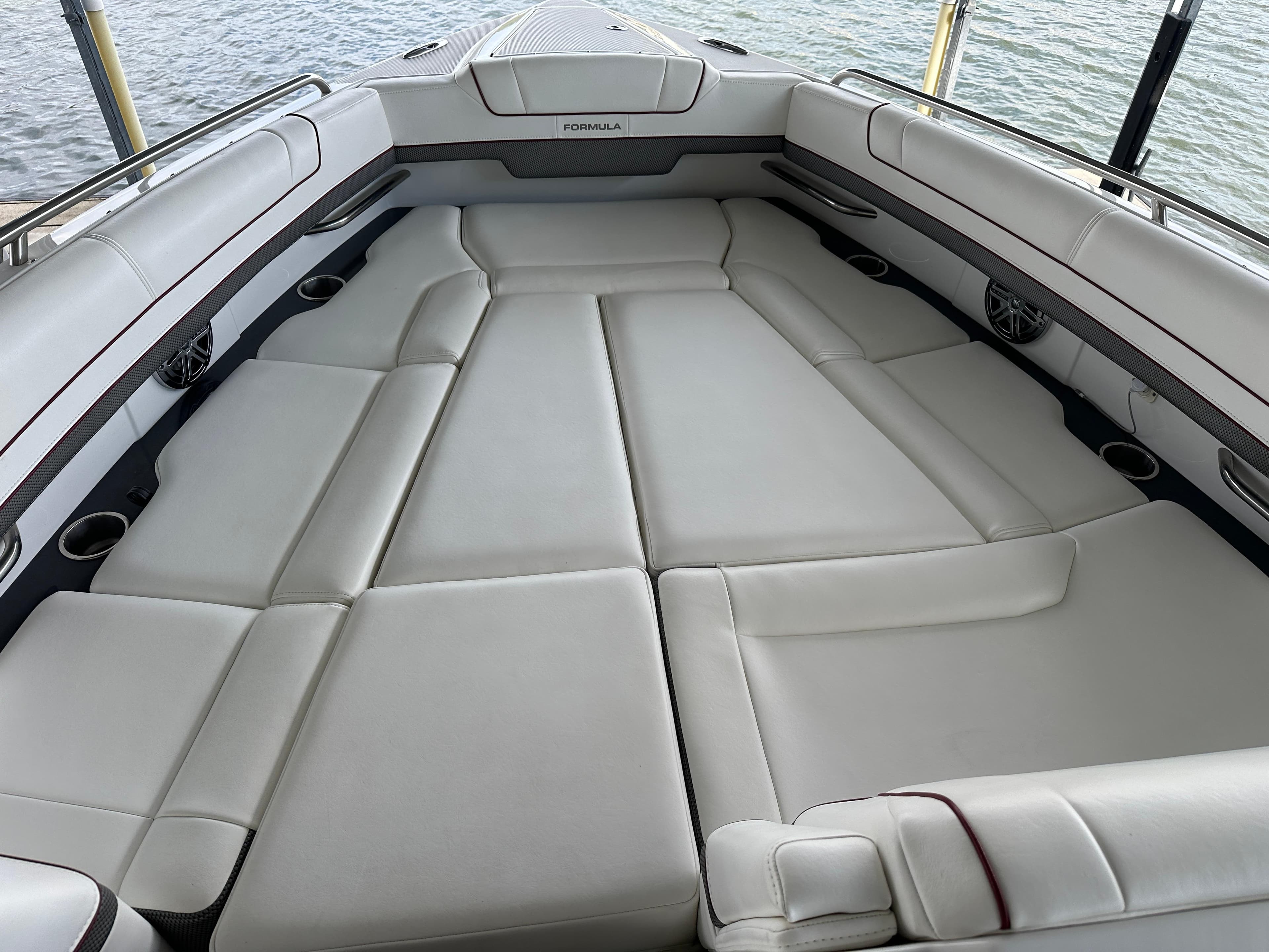 2016 Formula 330 Crossover Bowrider with spacious seating and sleek design on the water.