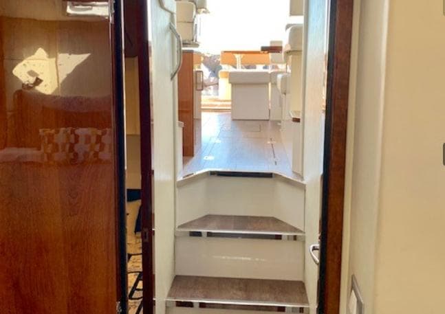 Interior view of 2016 Carver C37 yacht, featuring stairs leading to the deck area.