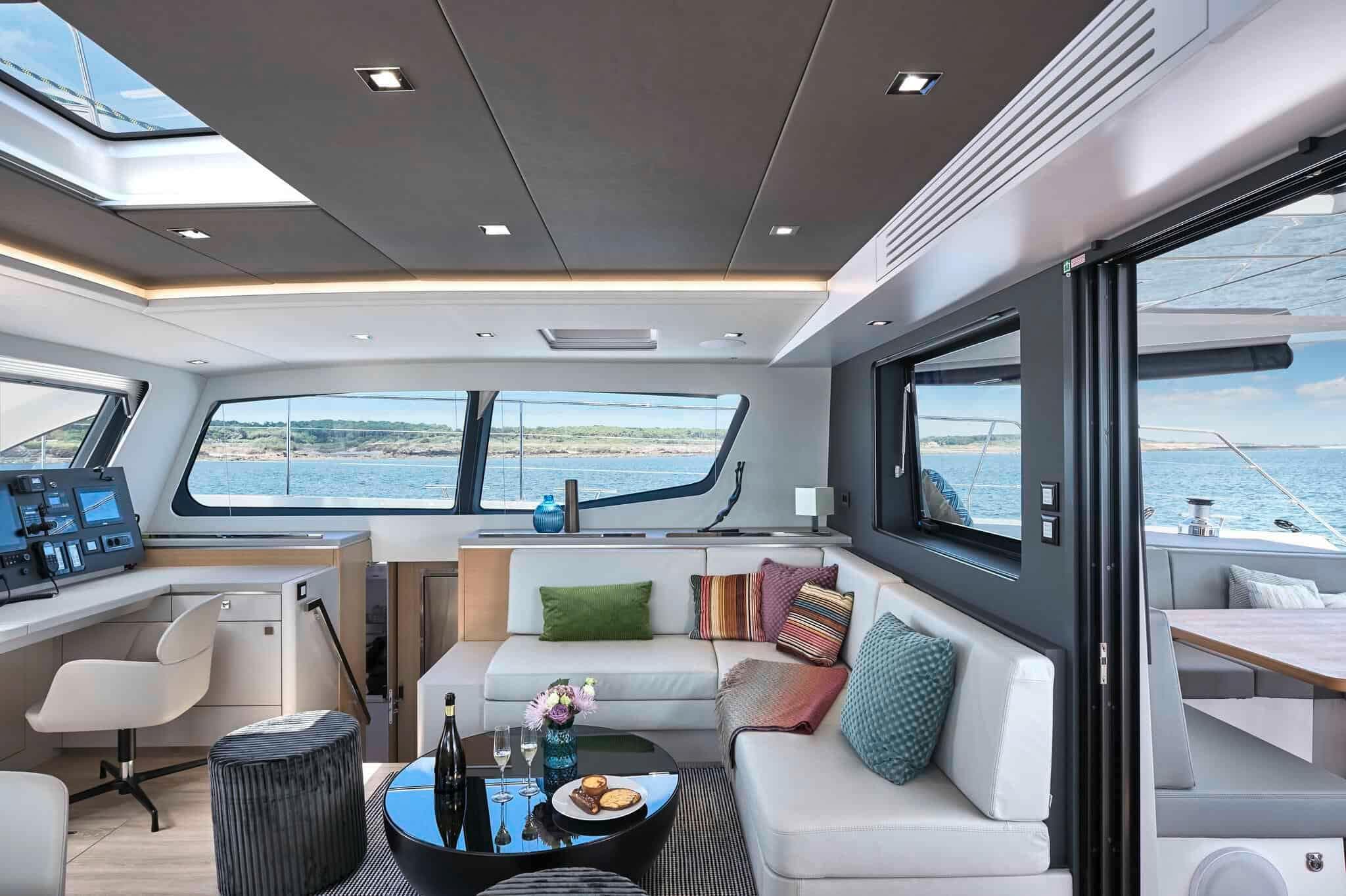 Luxurious interior of 2025 Privilege Signature 580 yacht with modern seating and ocean view.