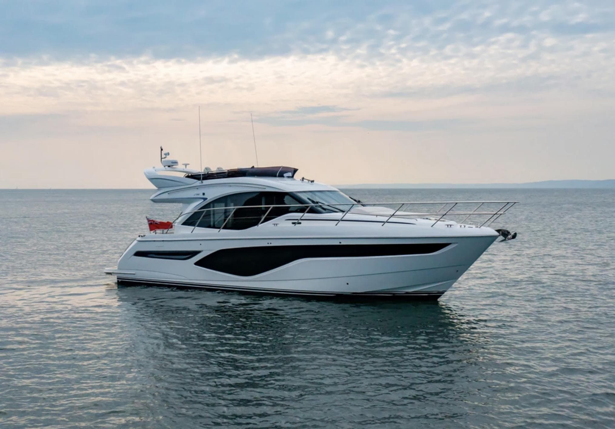 2025 Princess F50 yacht on calm sea under cloudy sky.