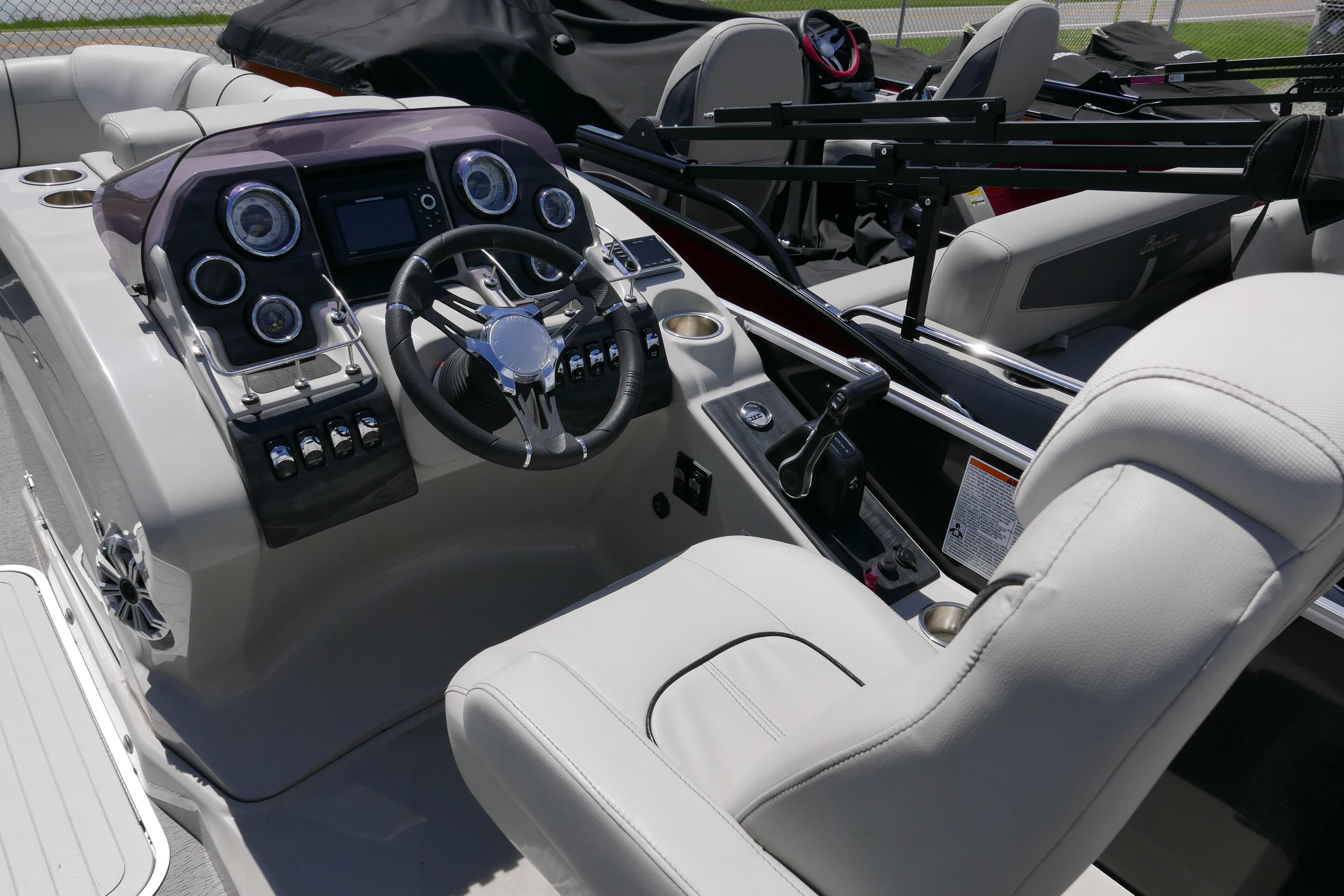 Cockpit of 2018 Sylvan S-3 boat with modern controls and comfortable seating.
