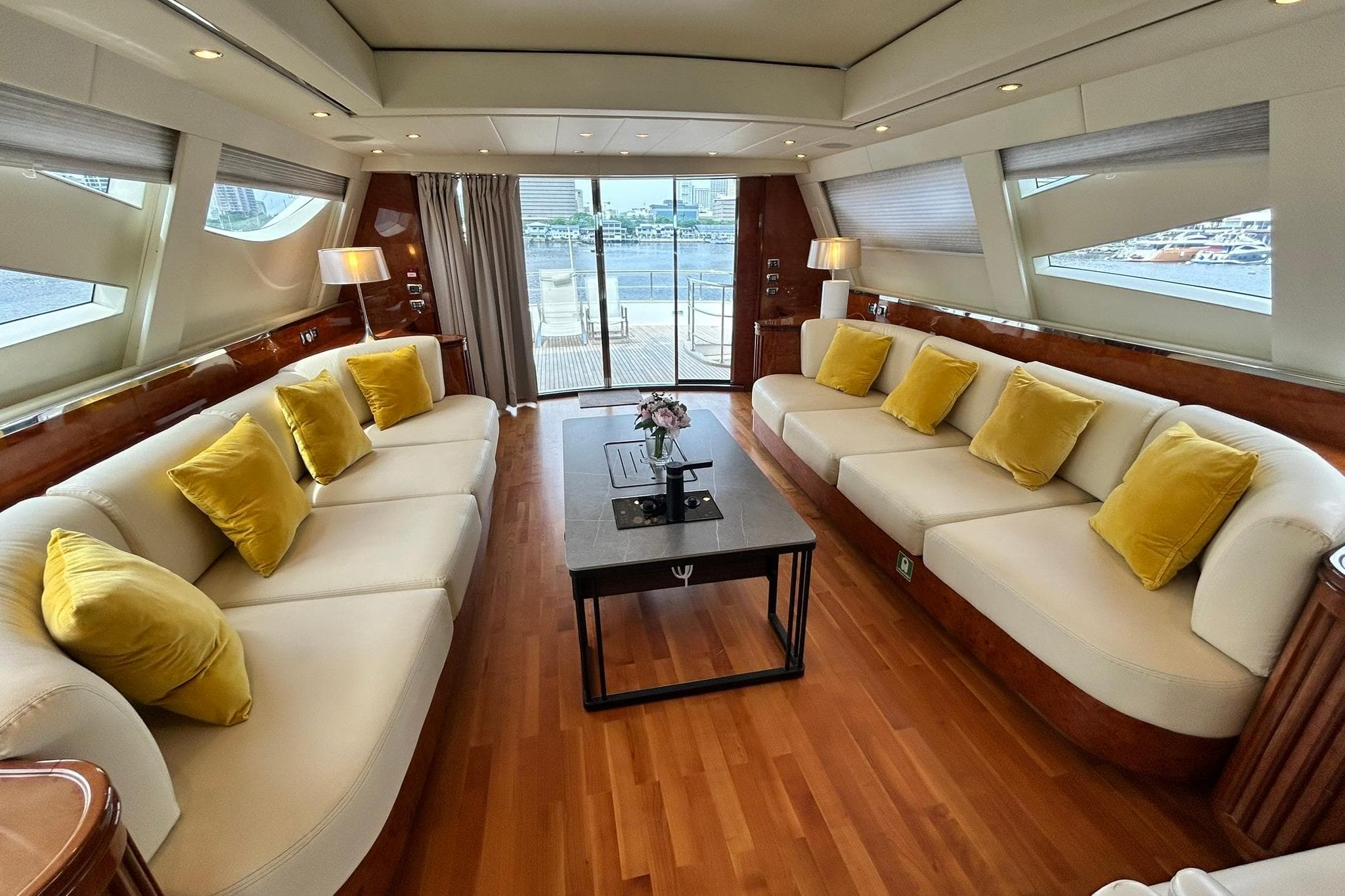 Luxurious Versilcraft Euroyacht Planet 125S interior with elegant sofas and yellow cushions, 2010 model.