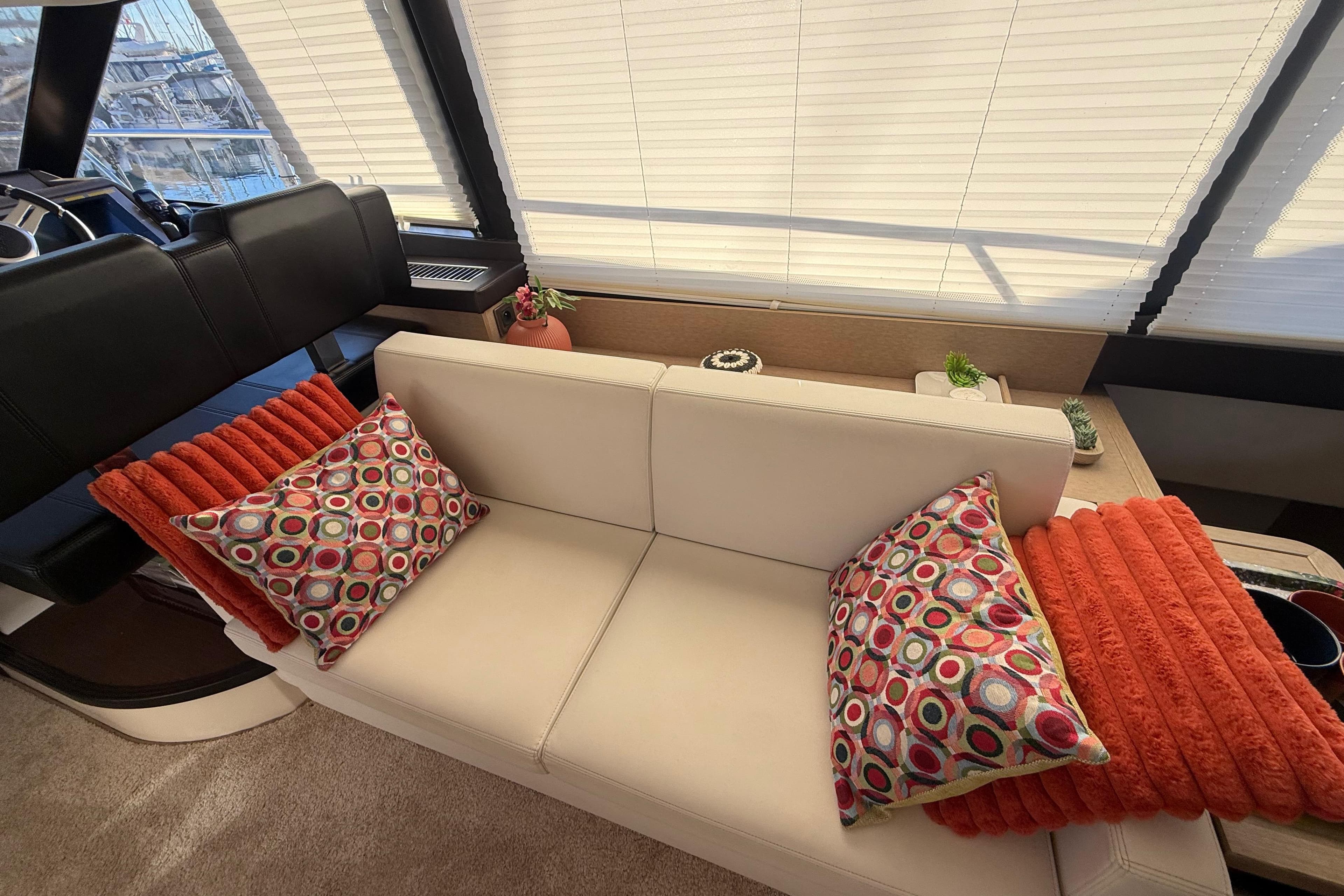 Luxurious interior of 2018 Prestige 500 yacht with stylish cushions and modern decor.