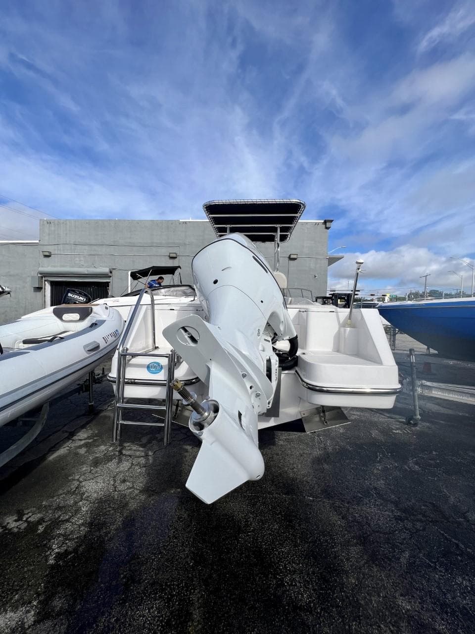 2022 Wellcraft 220CC boat with outboard motor on display.