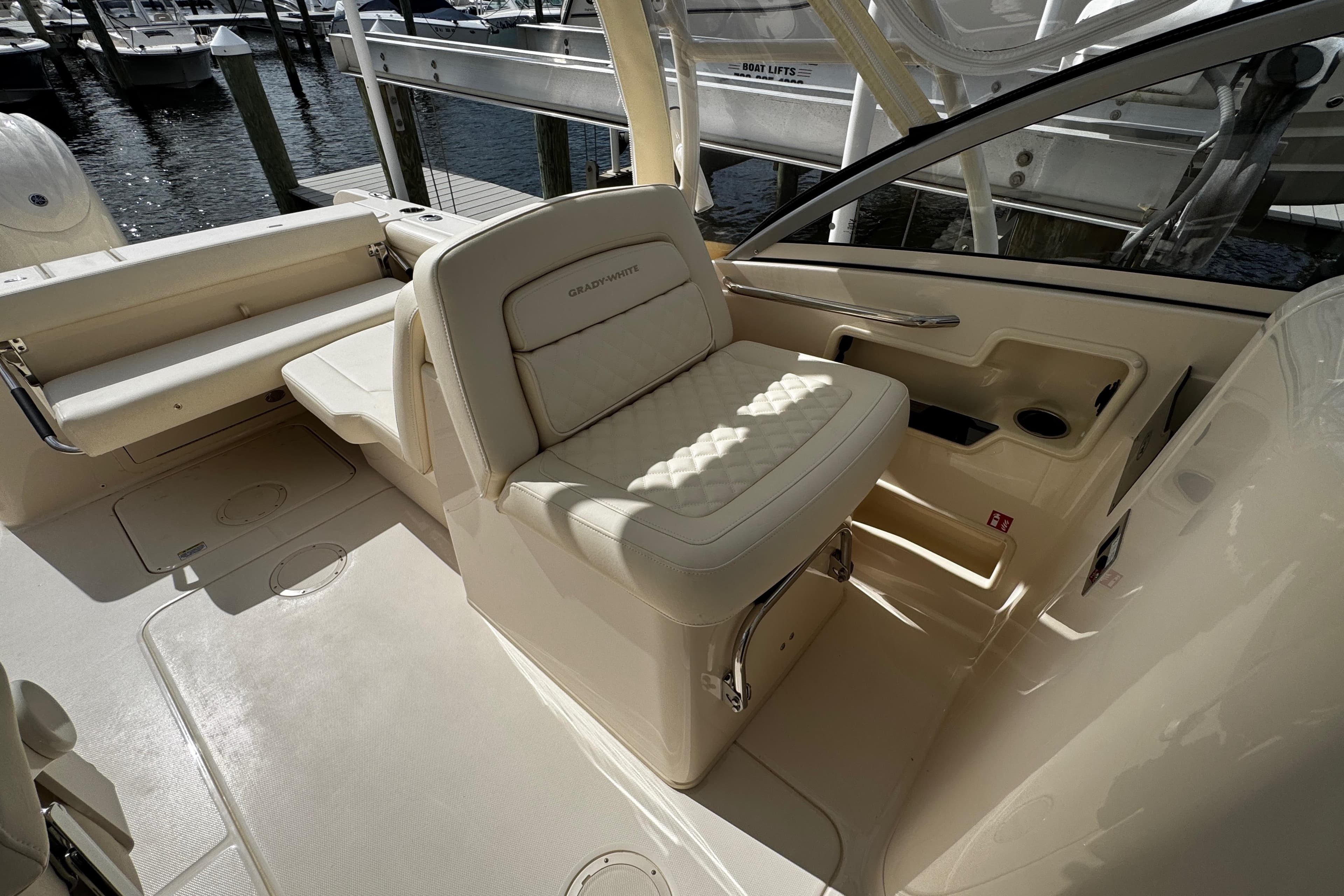 2026 Grady-White Freedom 235 boat interior with cushioned seating and sleek design.