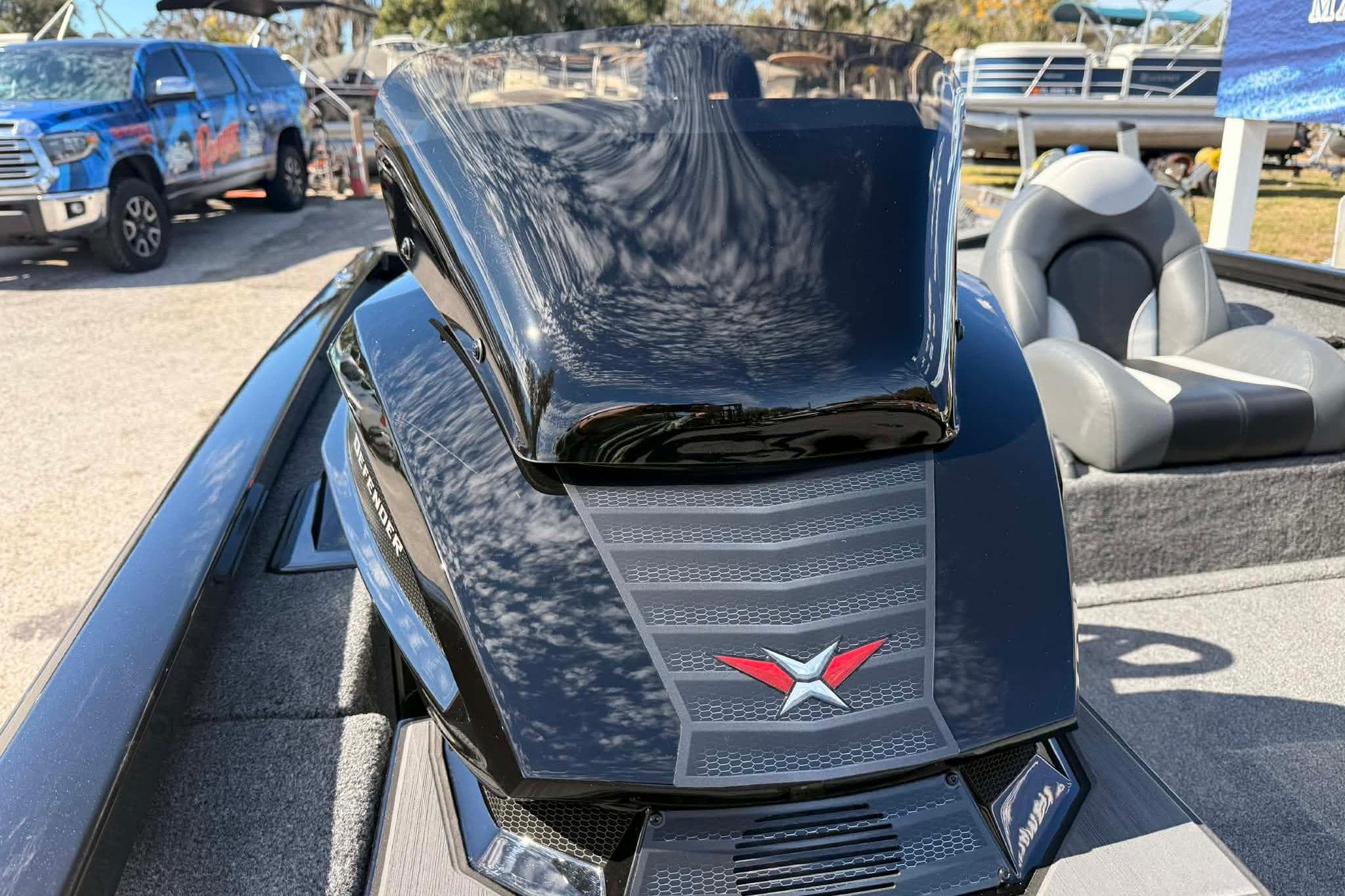 2026 Vexus Defender 181 boat with sleek black design and modern seating.