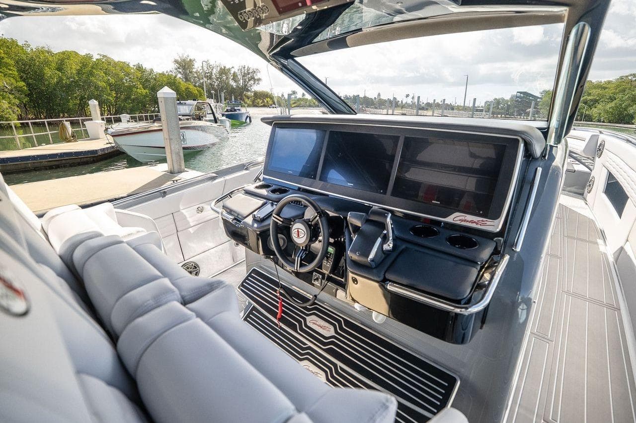 2026 Cigarette 42' Auroris luxury boat cockpit with advanced navigation screens and sleek design.
