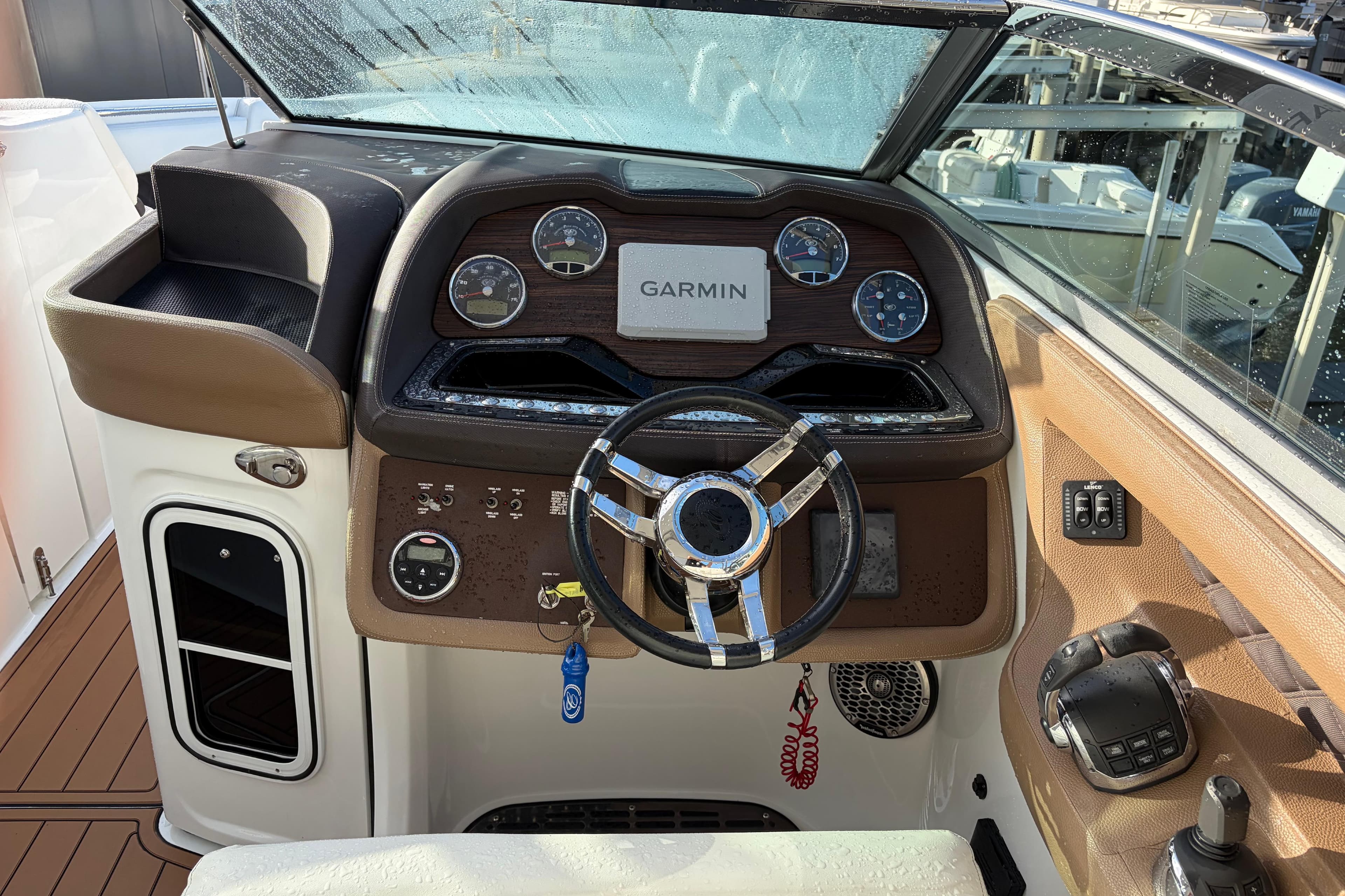 Cockpit of 2015 Cobalt 336 boat with Garmin navigation system and modern controls.