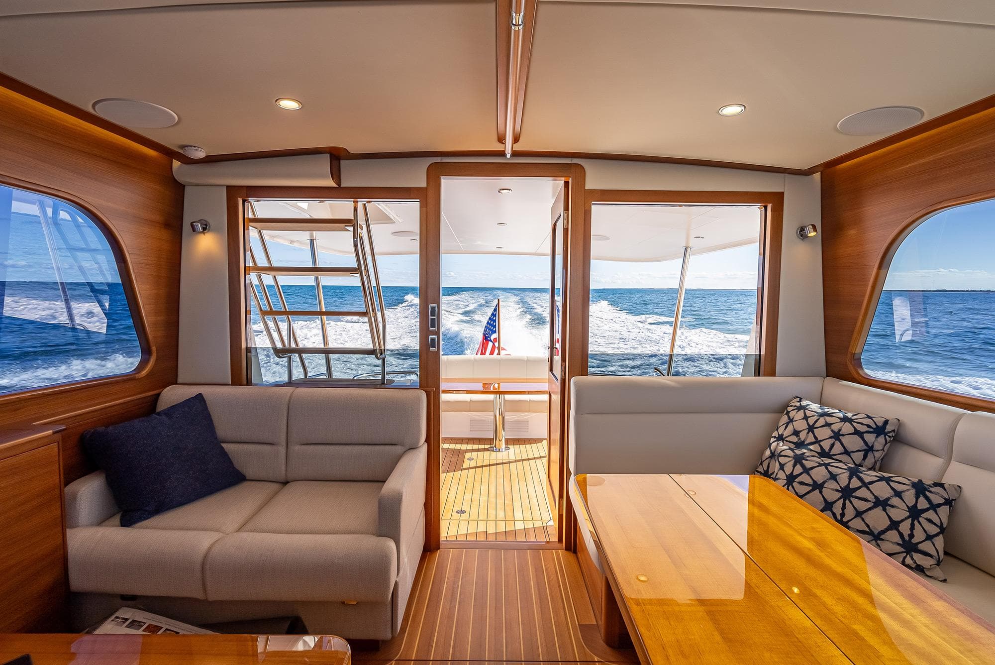 Interior view of 2026 Grand Banks GB 54 yacht, featuring elegant seating and ocean view.