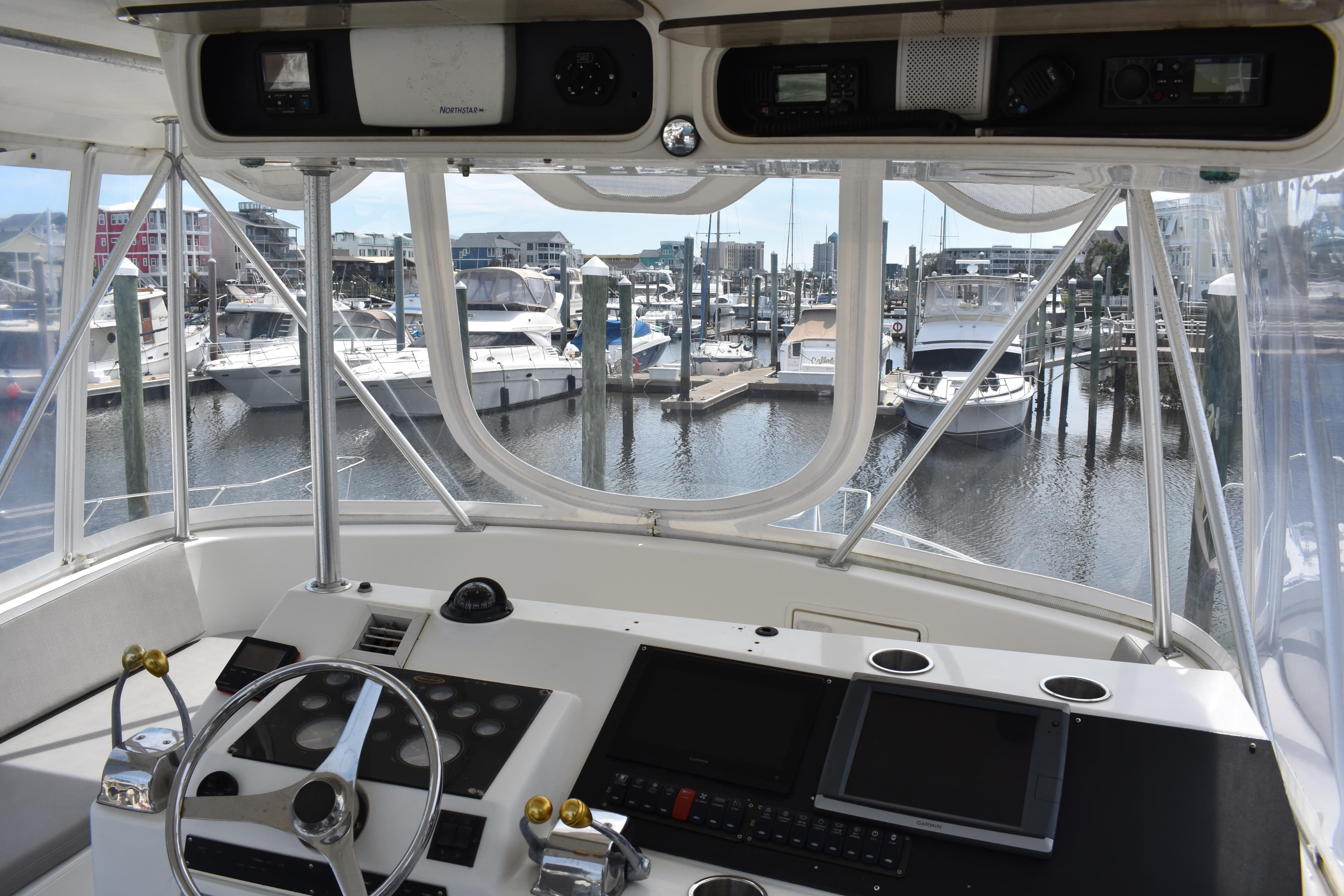 Cockpit view of 1998 Ocean Yachts 40 Super Sport in marina setting.