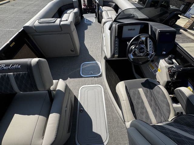 2025 Barletta Lusso L25MAT boat interior with luxurious seating and modern dashboard.