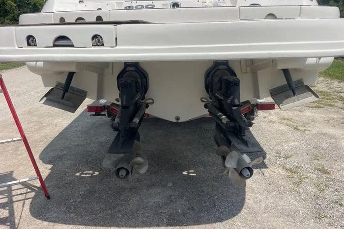 Rear view of a 2012 Sea Ray 300 SLX boat with dual propellers.