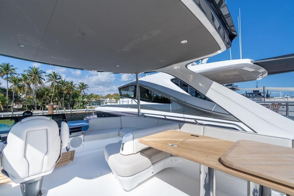 Luxurious deck of Princess S65 yacht, 2026 model, featuring elegant furnishings.