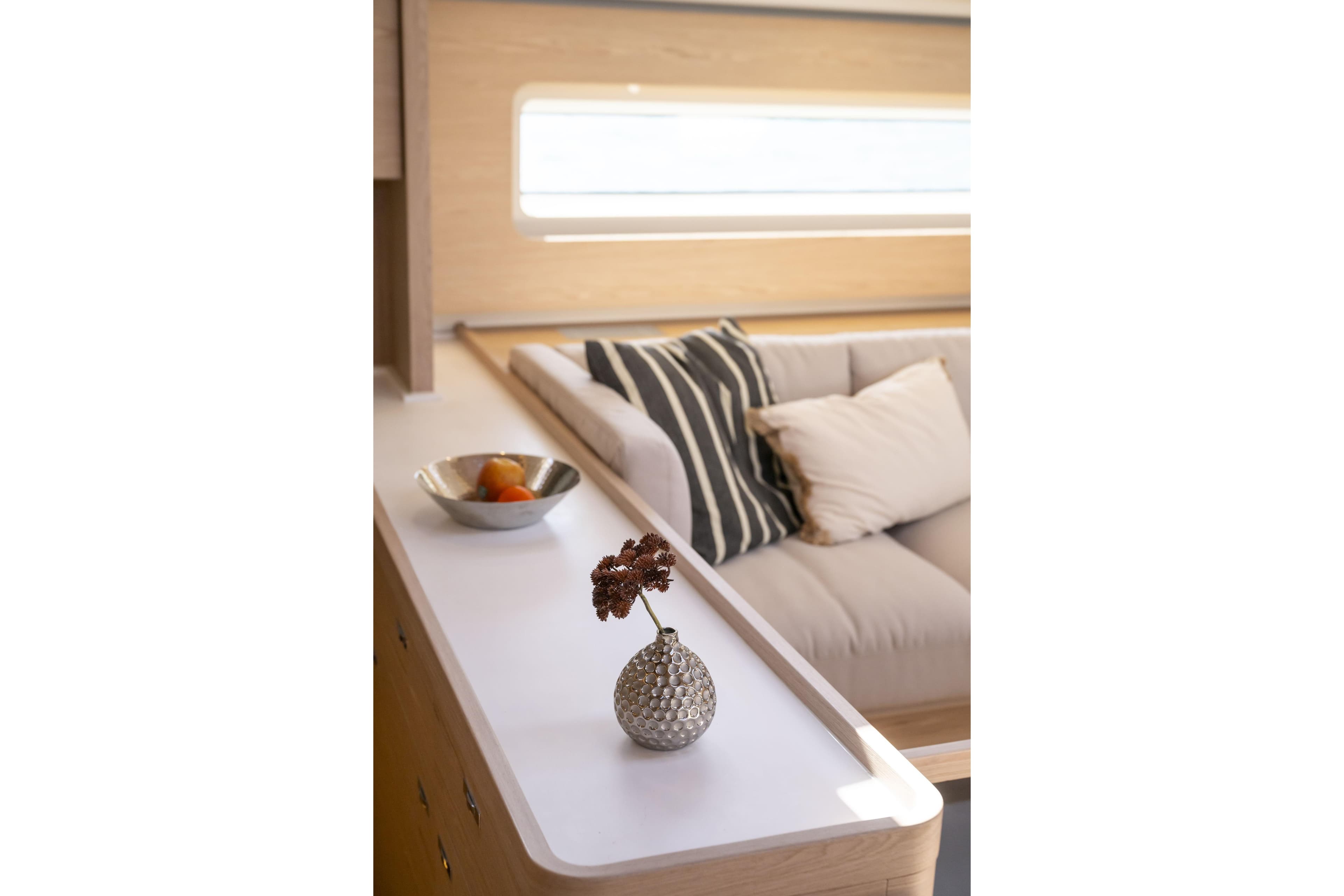 Interior of 2023 Beneteau Oceanis Yacht 60, featuring elegant decor and comfortable seating.