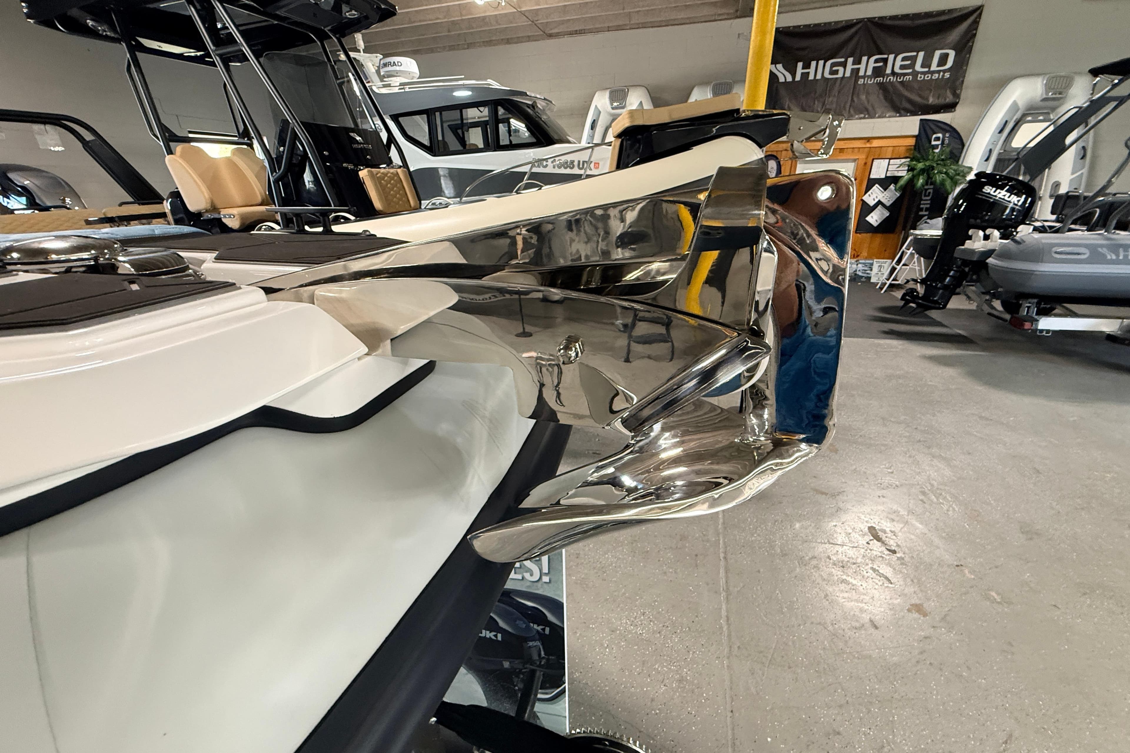2026 Highfield ADV7 boat with sleek chrome detailing in a showroom.