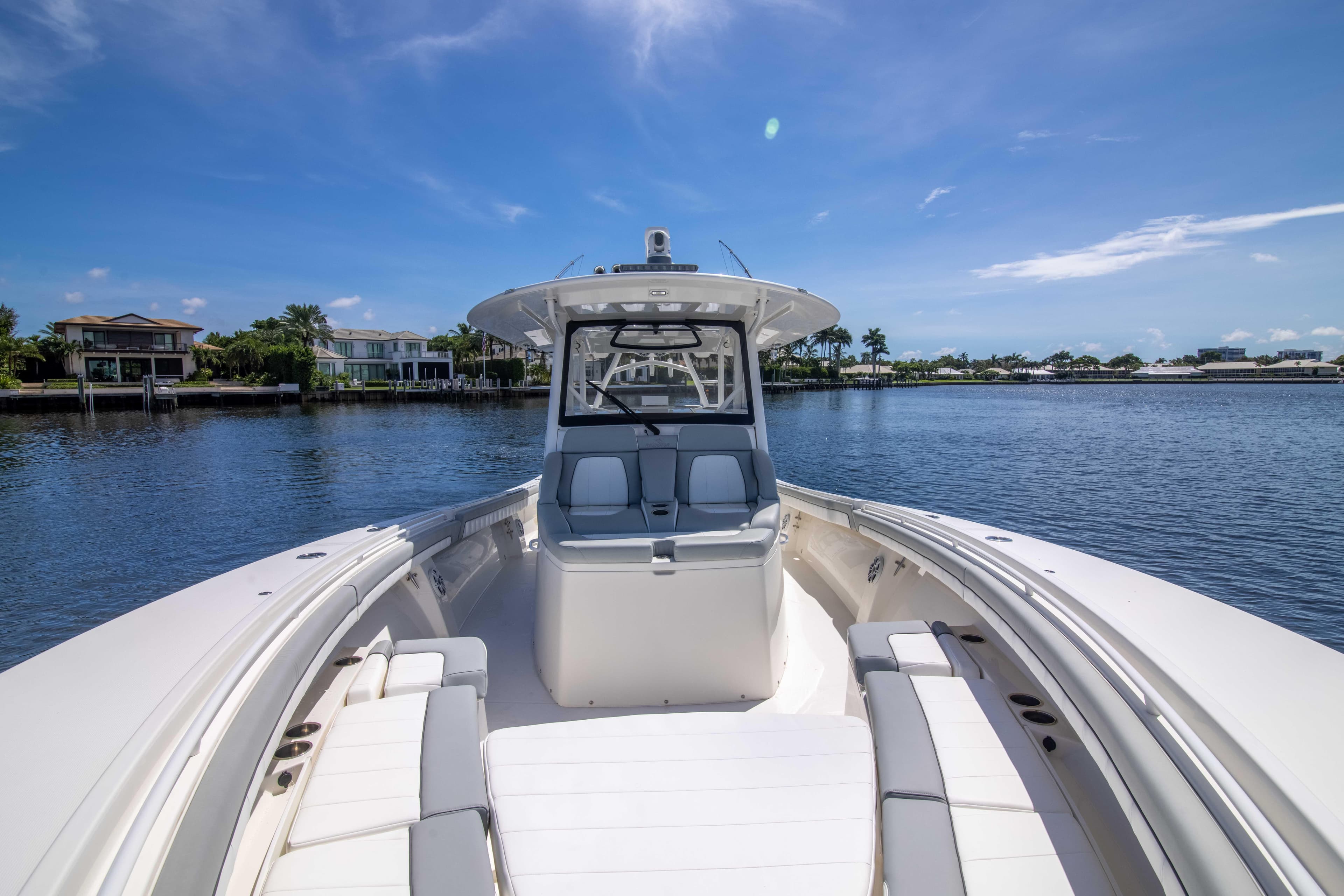2021 Regulator 41 boat on calm water under clear blue sky.
