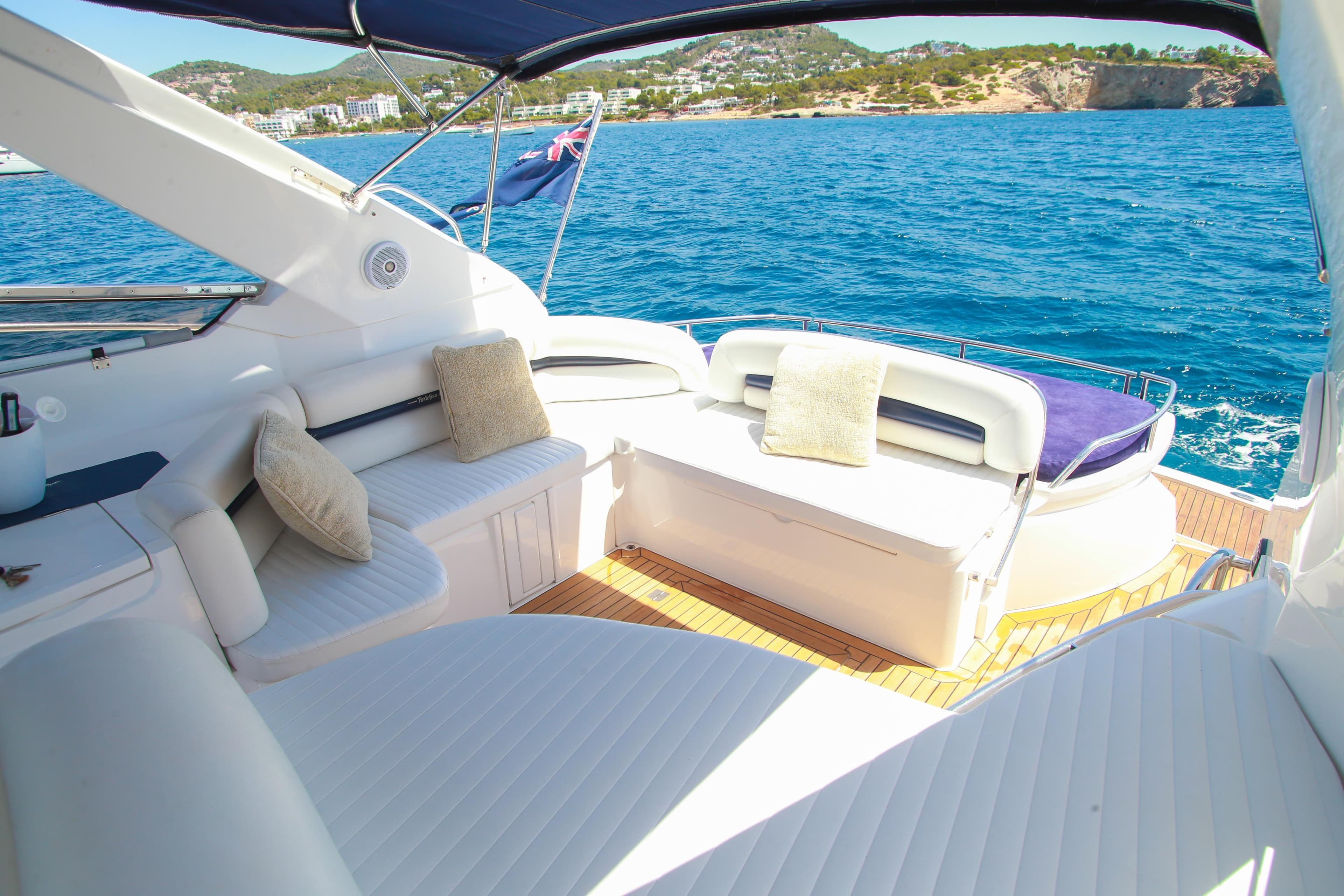 Luxurious 2007 Sunseeker Portofino 47 Open yacht with elegant seating and ocean view.
