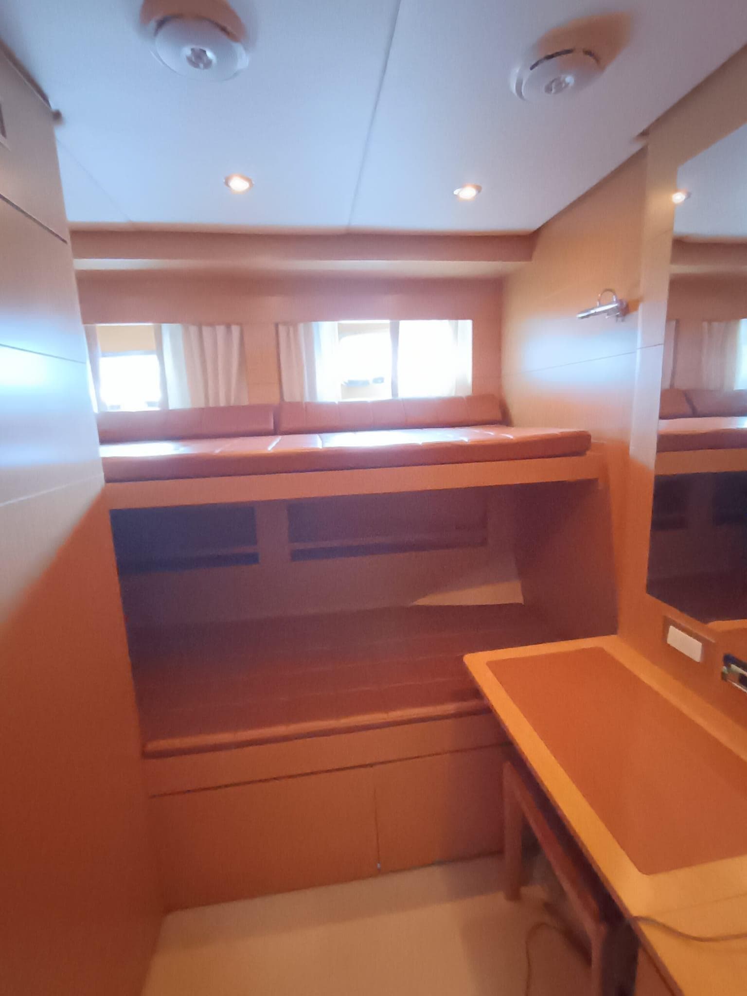 Interior cabin of 2007 Grand Banks 59 Aleutian RP yacht with wooden furnishings.