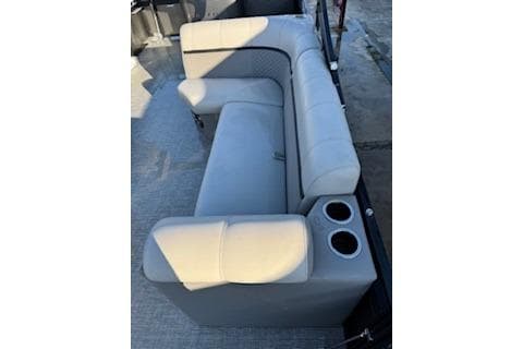 2023 Angler Quest 8522 All Sport boat interior with gray seating and cup holders.