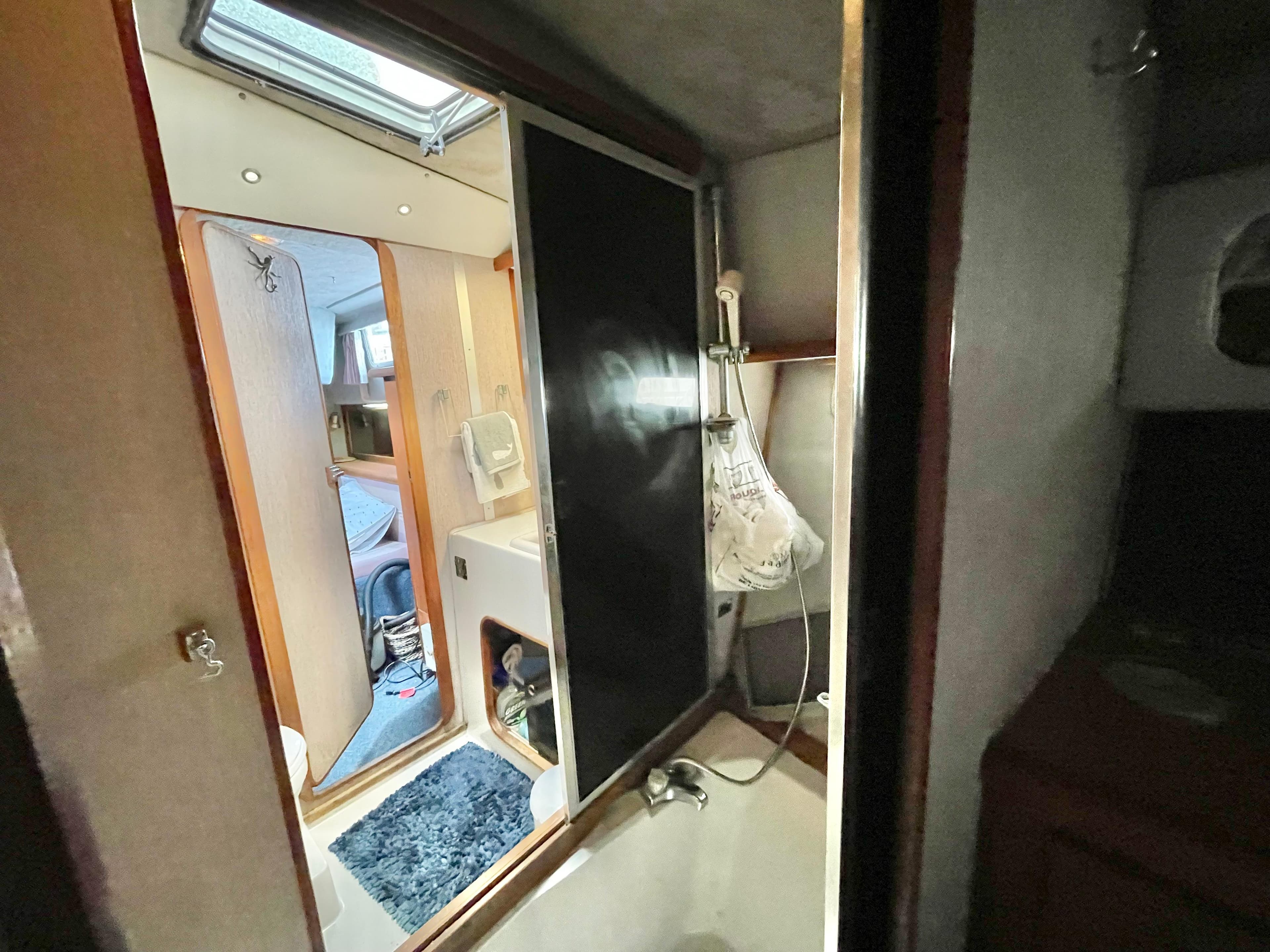 Interior of 1987 Bayliner 3870 Motoryacht showing bathroom and cabin area.