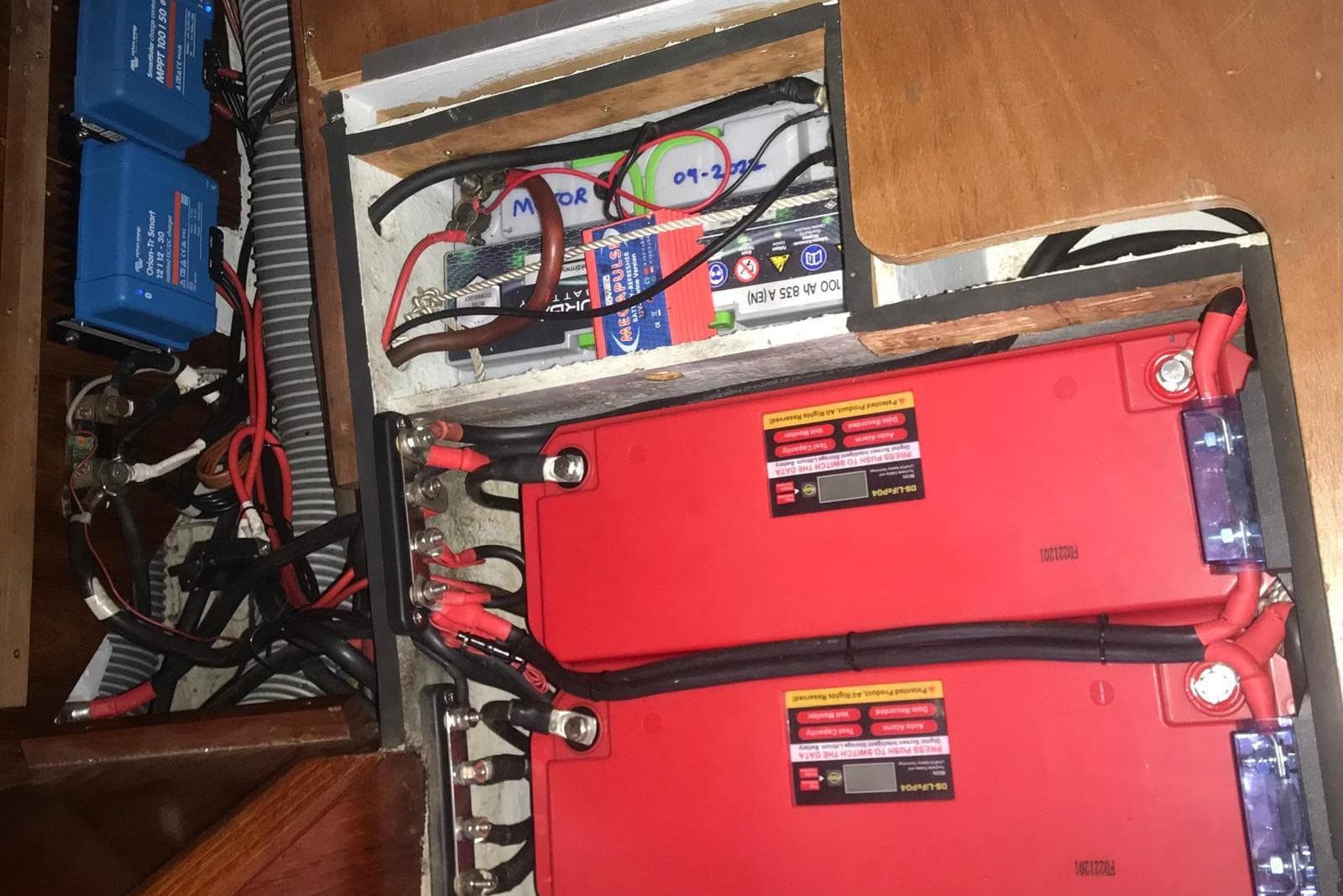 Electrical system of a 1995 Jeanneau Sun Odyssey 45.1 sailboat, featuring batteries and wiring.