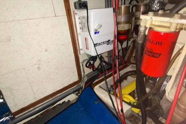 Engine room of 1980 Ocean Alexander 50 Mark I with electrical and fuel components.