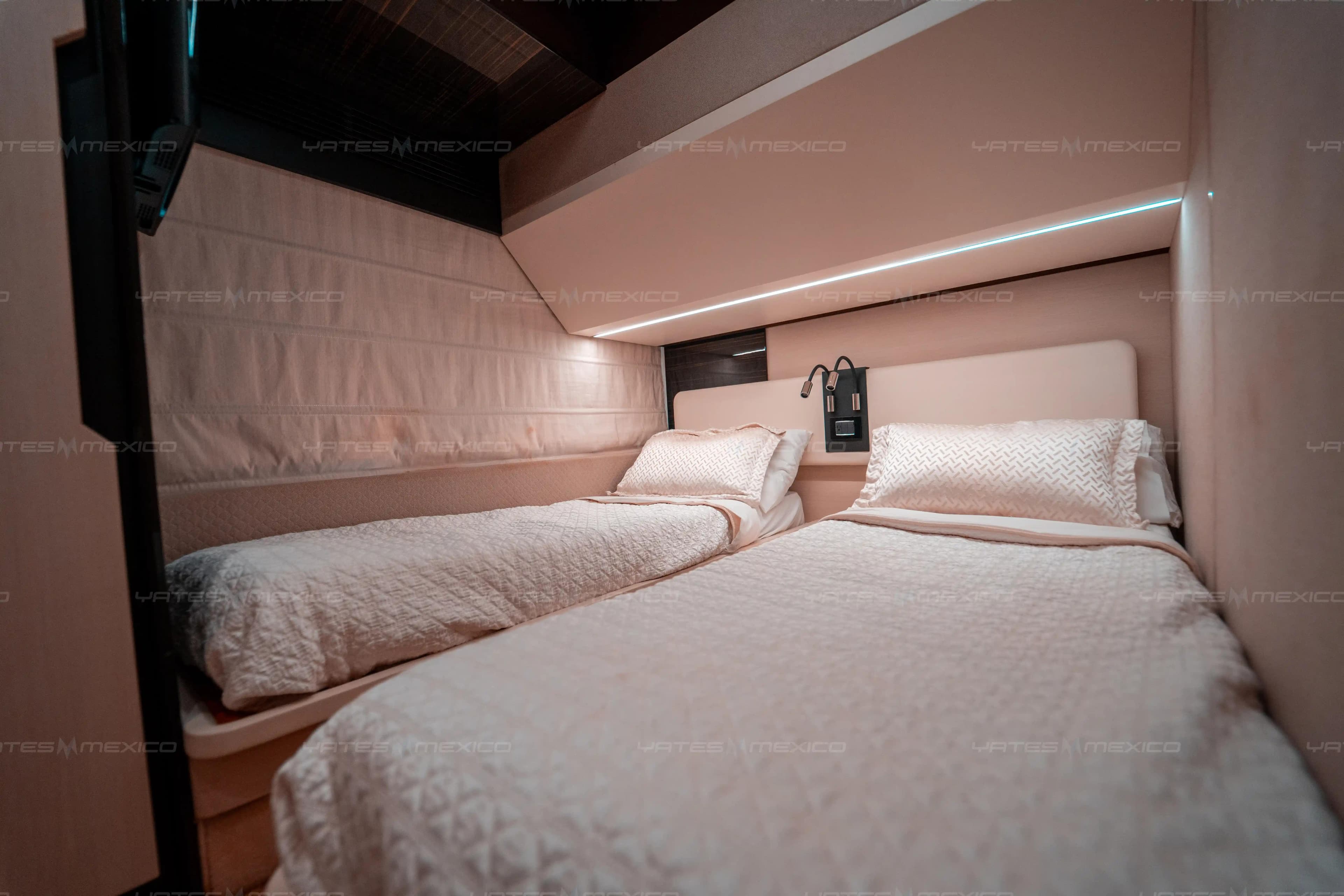 Luxurious twin bedroom in 2017 Azimut 66 yacht, featuring elegant bedding and modern lighting.