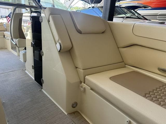 2025 Chris-Craft Launch 28 GT interior with beige seating and modern design.