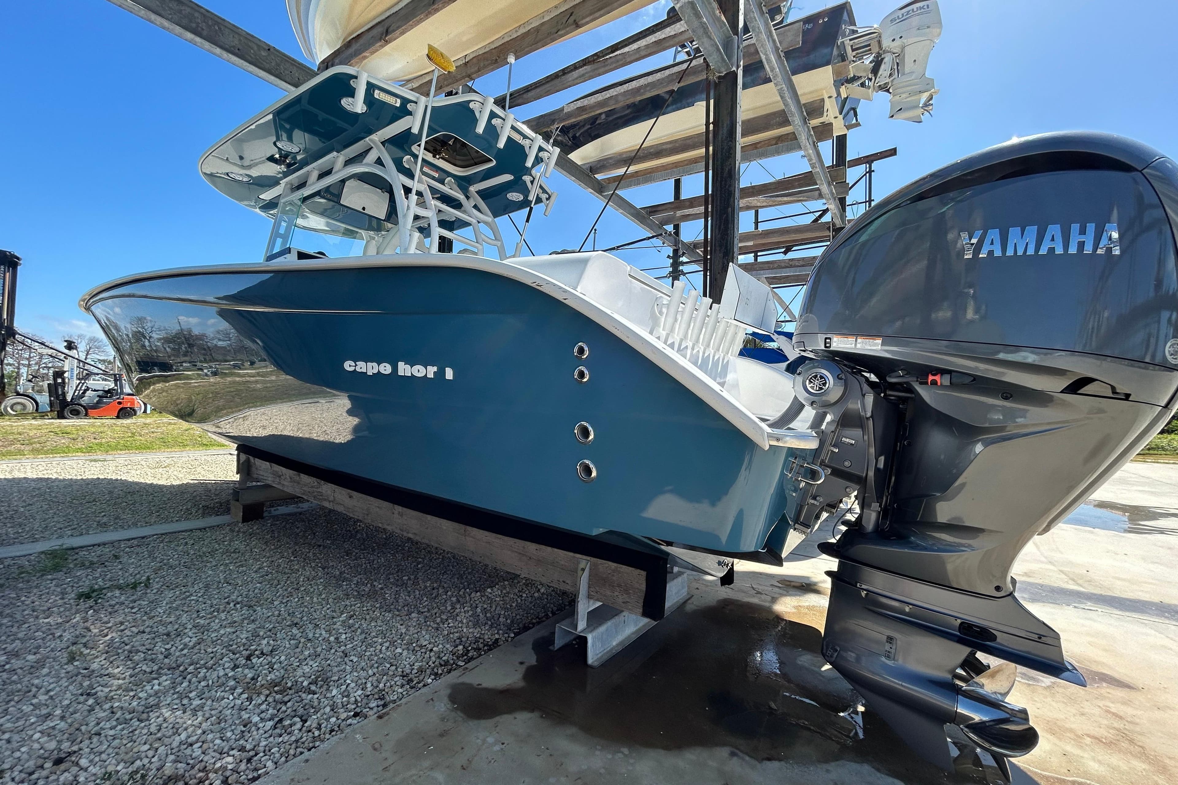 2022 Cape Horn 36 boat with Yamaha engine, displayed on a stand outdoors.