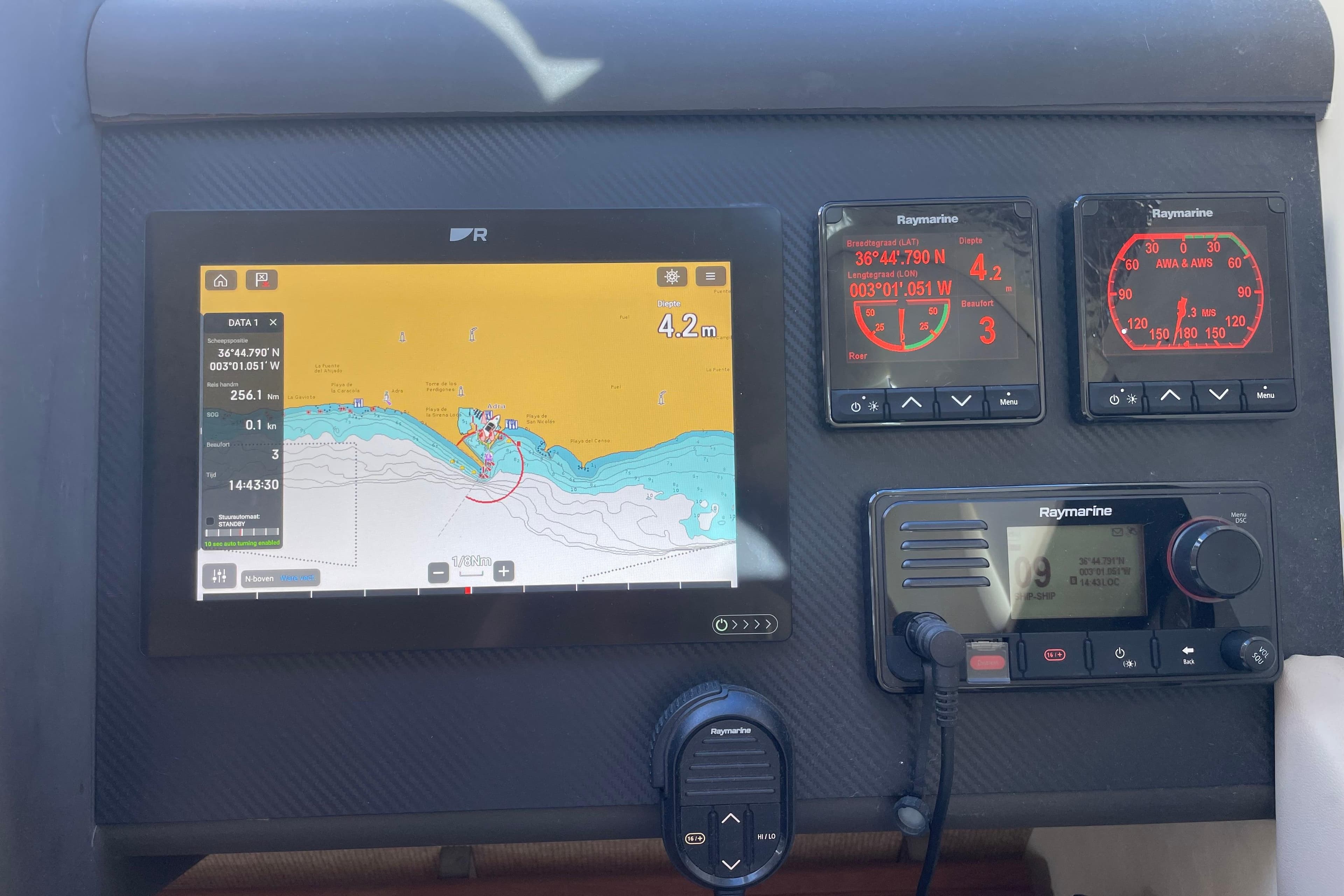 Navigation dashboard of a 2001 Fairline Squadron 58 yacht with Raymarine equipment.