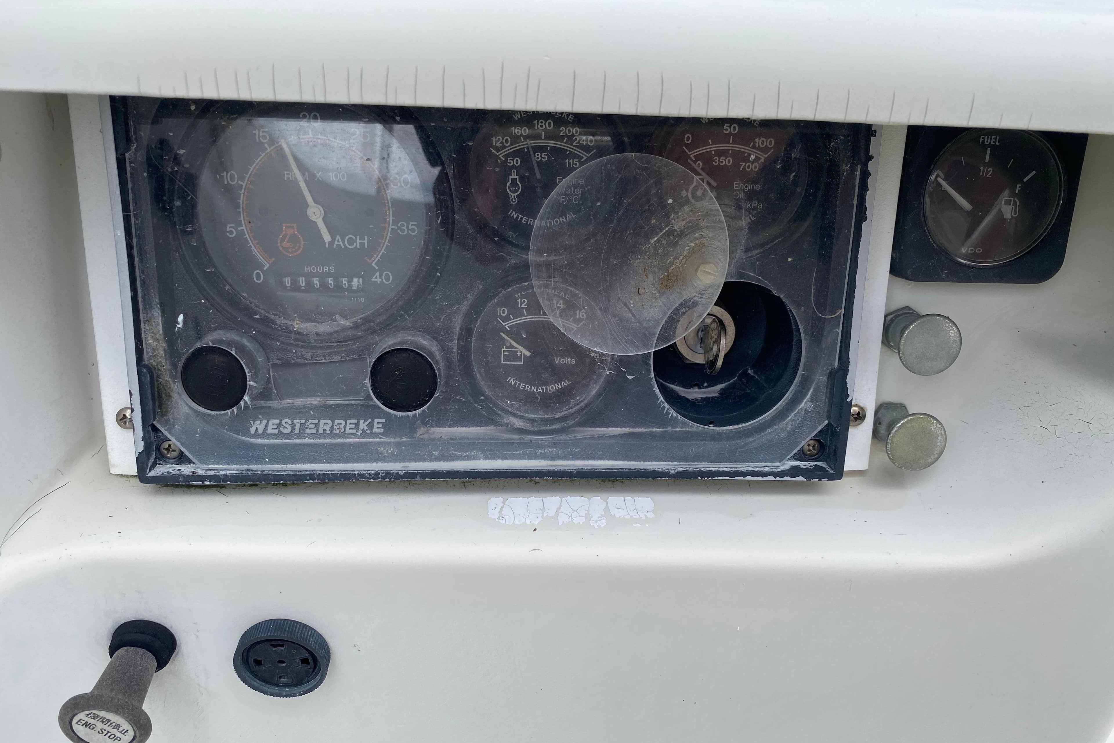Dashboard of a 1981 C&C 40 sailboat with Westerbeke engine gauges.