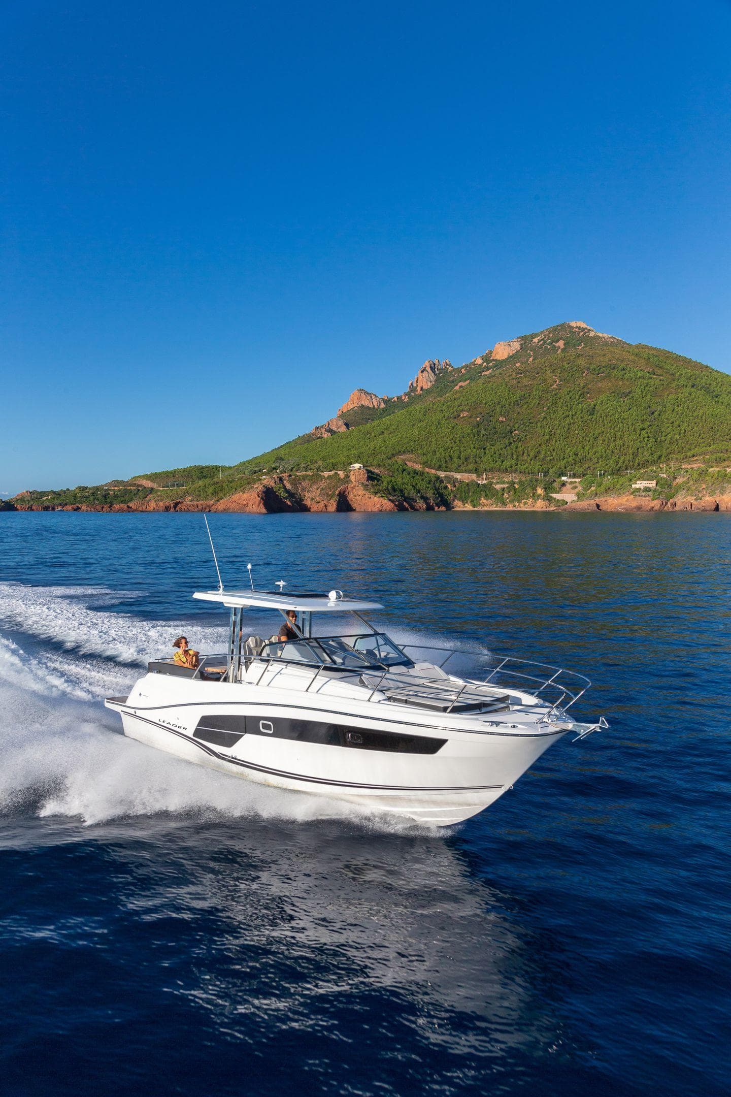 2025 Jeanneau Leader 10.5 WA Series 2 cruising on blue ocean near scenic coastline.