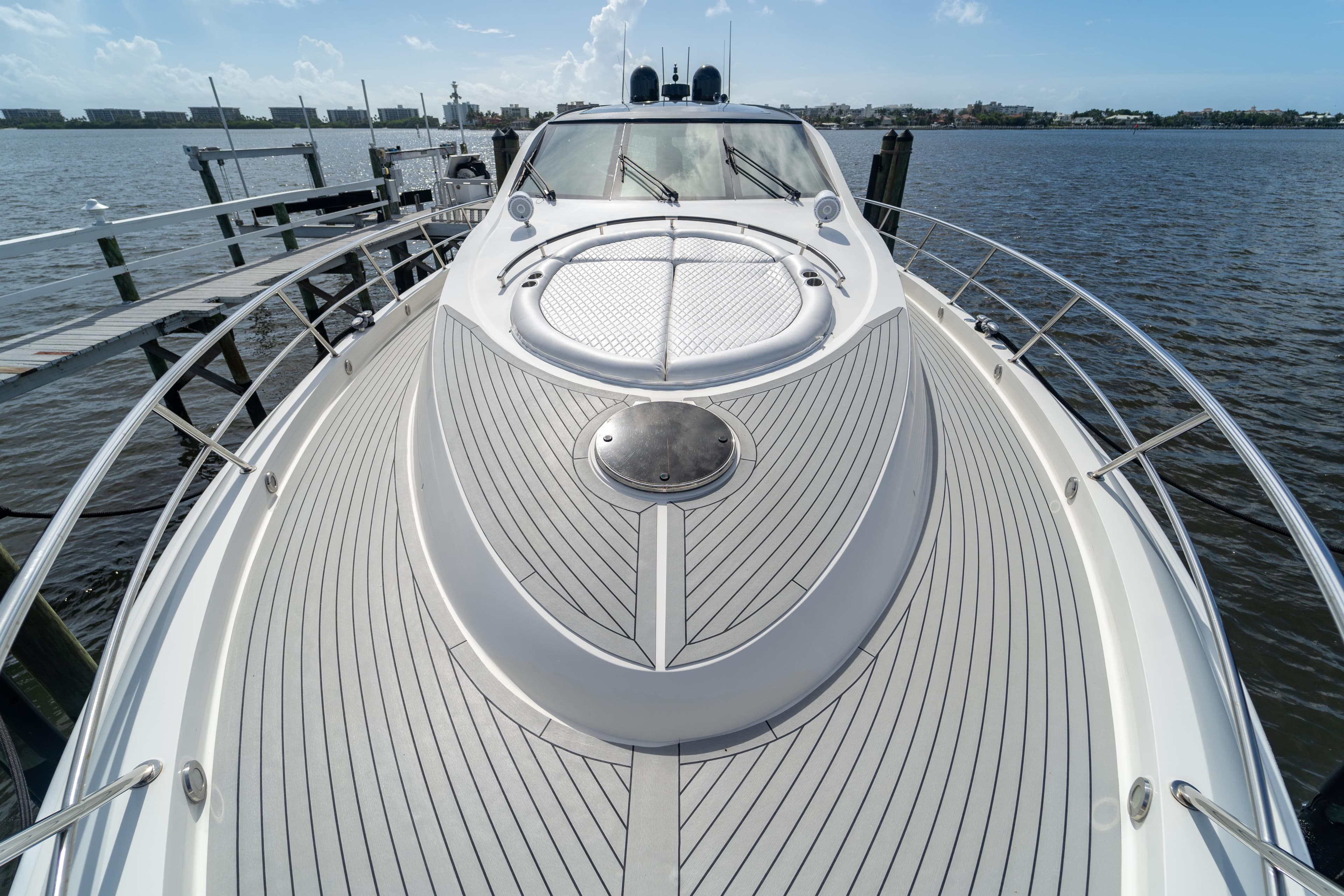 2009 Lazzara LSX 75 yacht deck with sleek design, docked by the water.