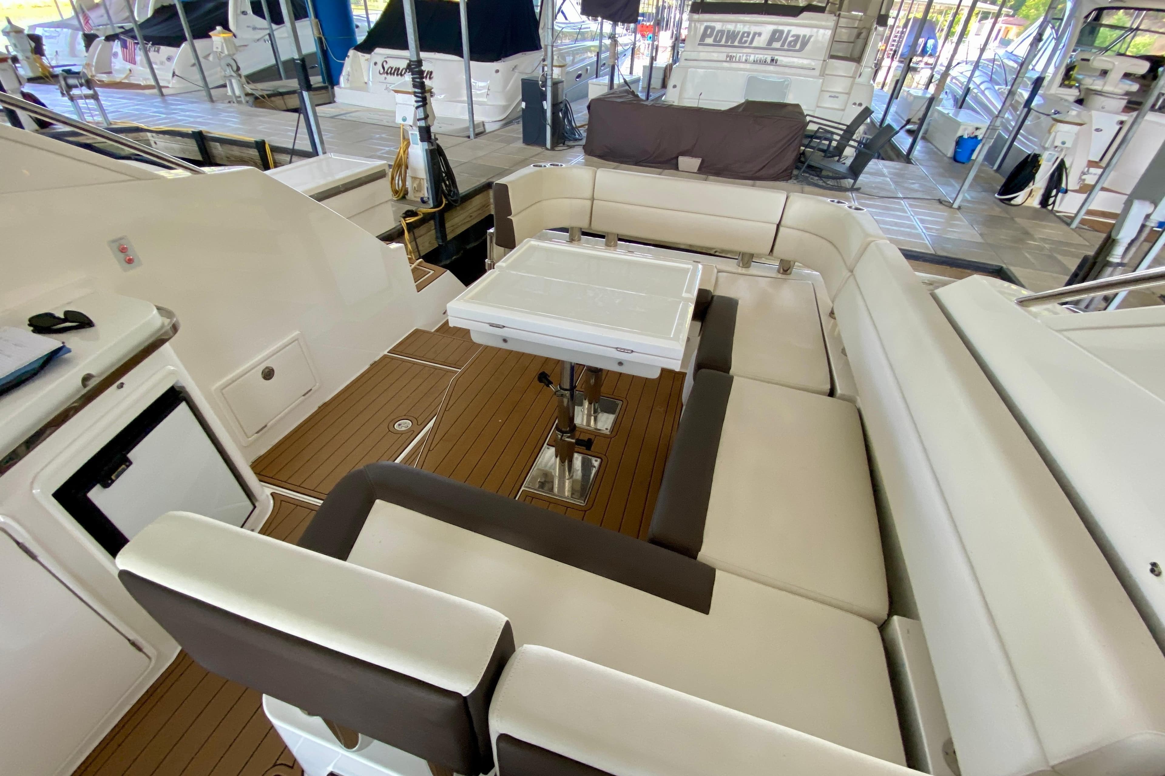Interior of 2018 Galeon 385 HTS yacht with elegant seating and wooden flooring.