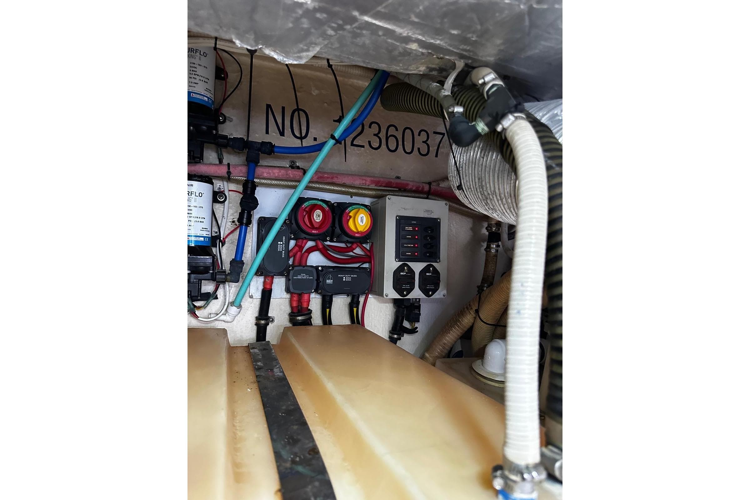 Engine room of 2012 Riviera 43 Flybridge with wiring and control panel.