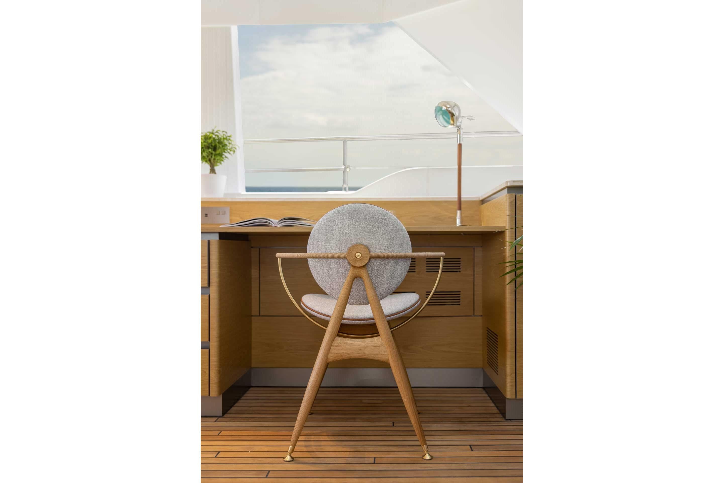 Modern yacht interior with wooden desk and stylish chair, Sunreef 80 Sunreef Power 2026.