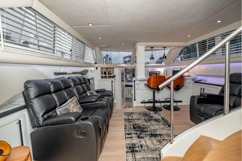 Luxurious interior of 1991 Cruisers Yachts 3850 Aft Cabin with leather seating and modern decor.