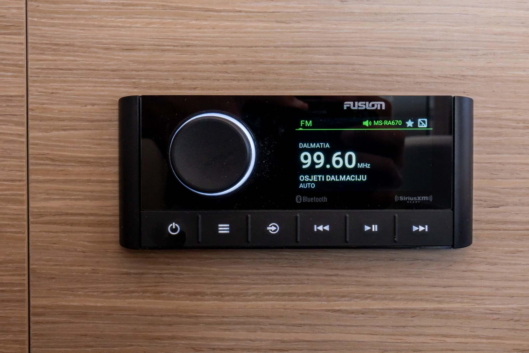 Fusion radio display on 2024 Lagoon 46 yacht, showing FM station 99.60 MHz.