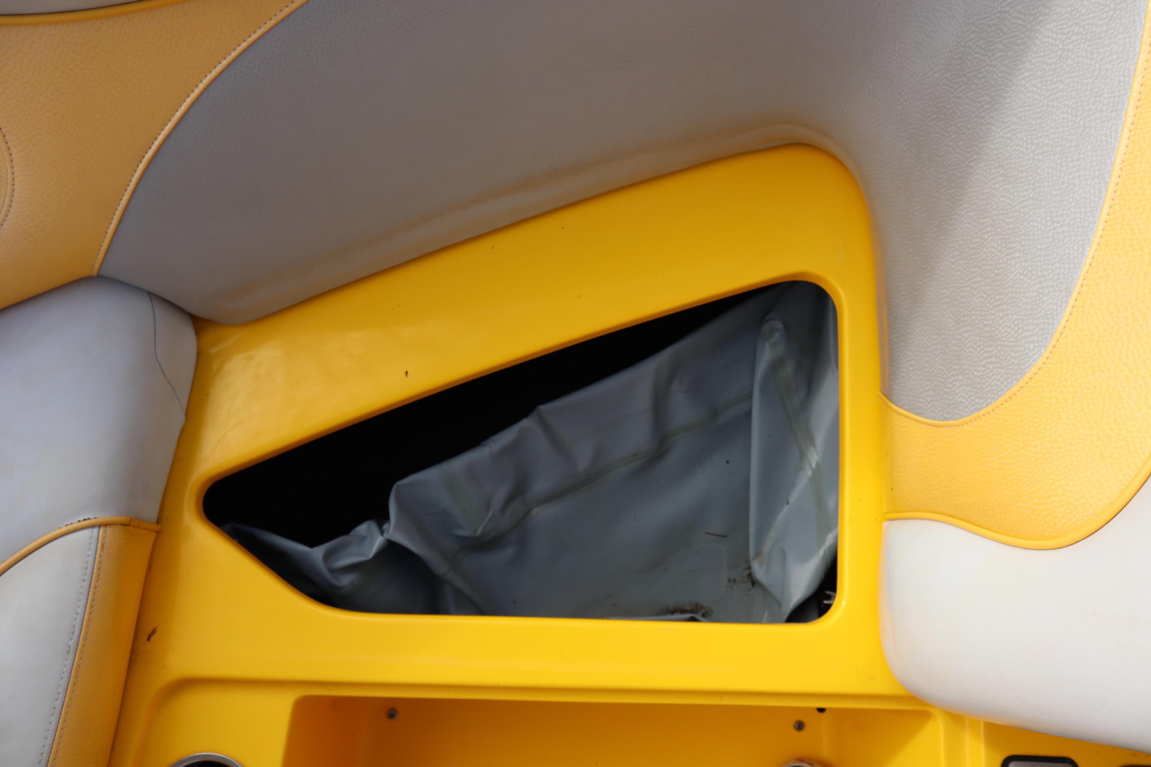 2014 Centurion Enzo SS210 interior detail with yellow and gray upholstery.