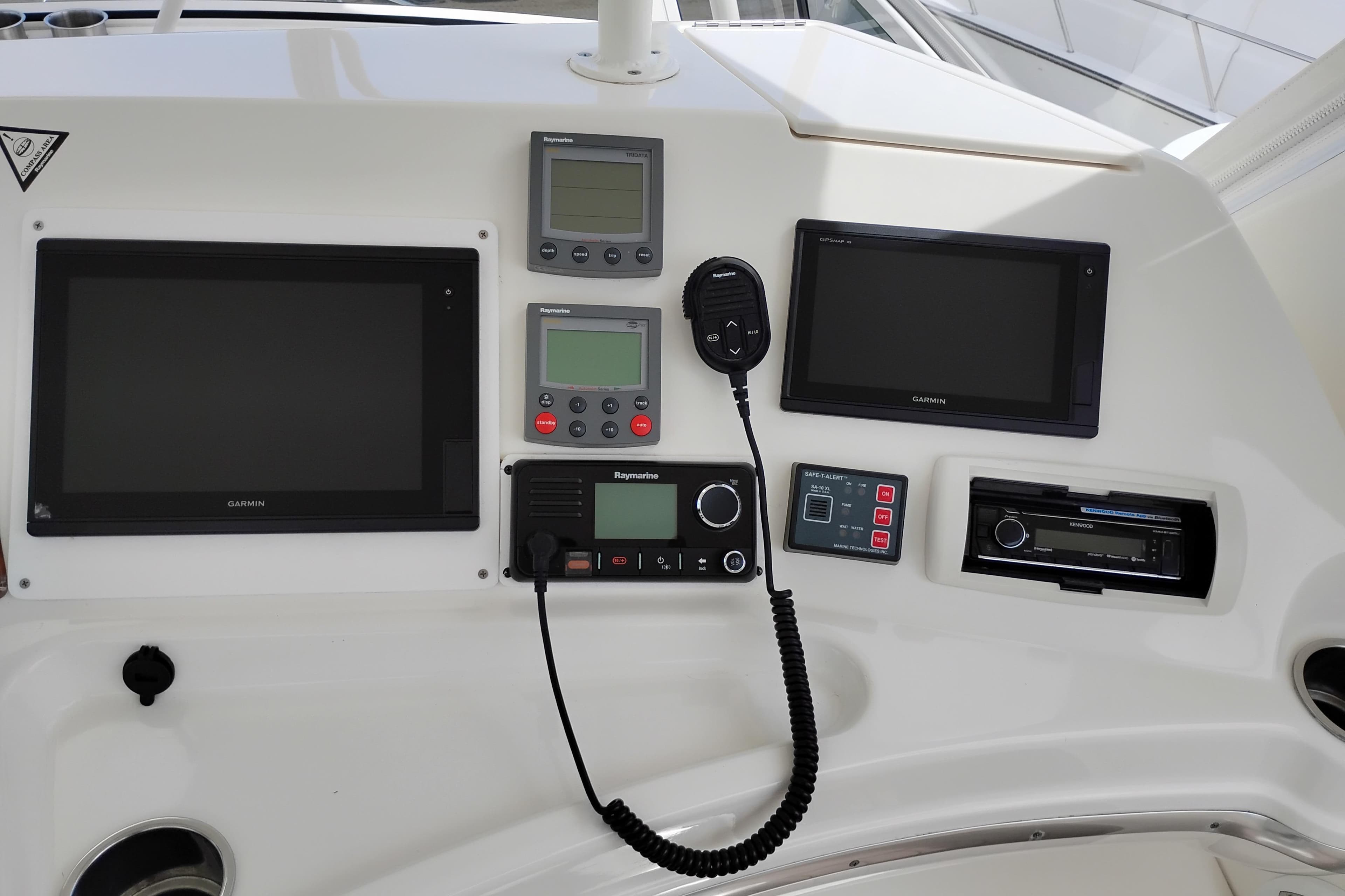 Control panel of a 2005 Silverton 38 Convertible boat with navigation equipment.