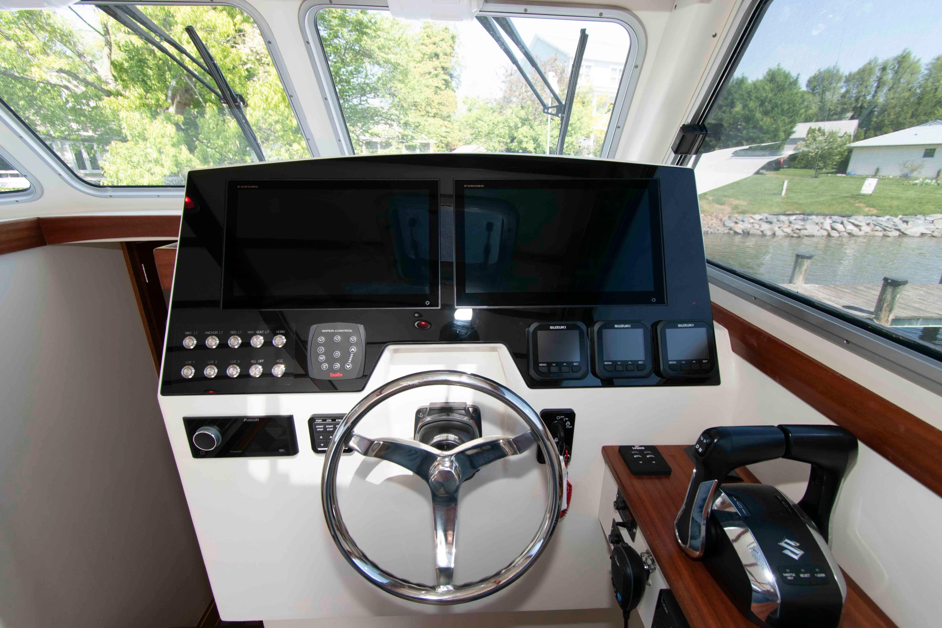 Helm of 2024 Composite Yacht CY 42 with modern navigation controls and dual screens.
