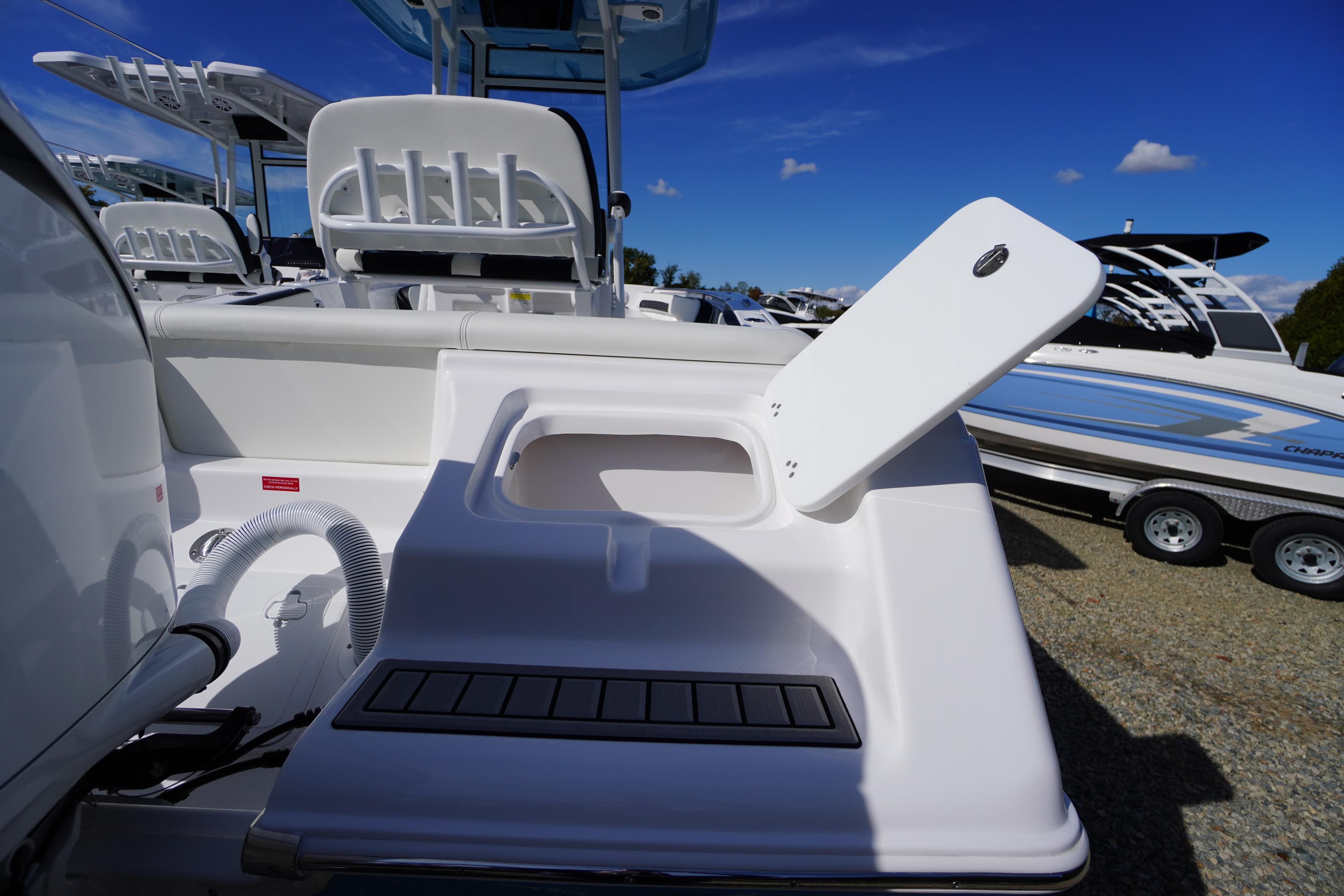 2026 Tidewater 220 LXF boat with open storage compartment, sleek design, and modern features.