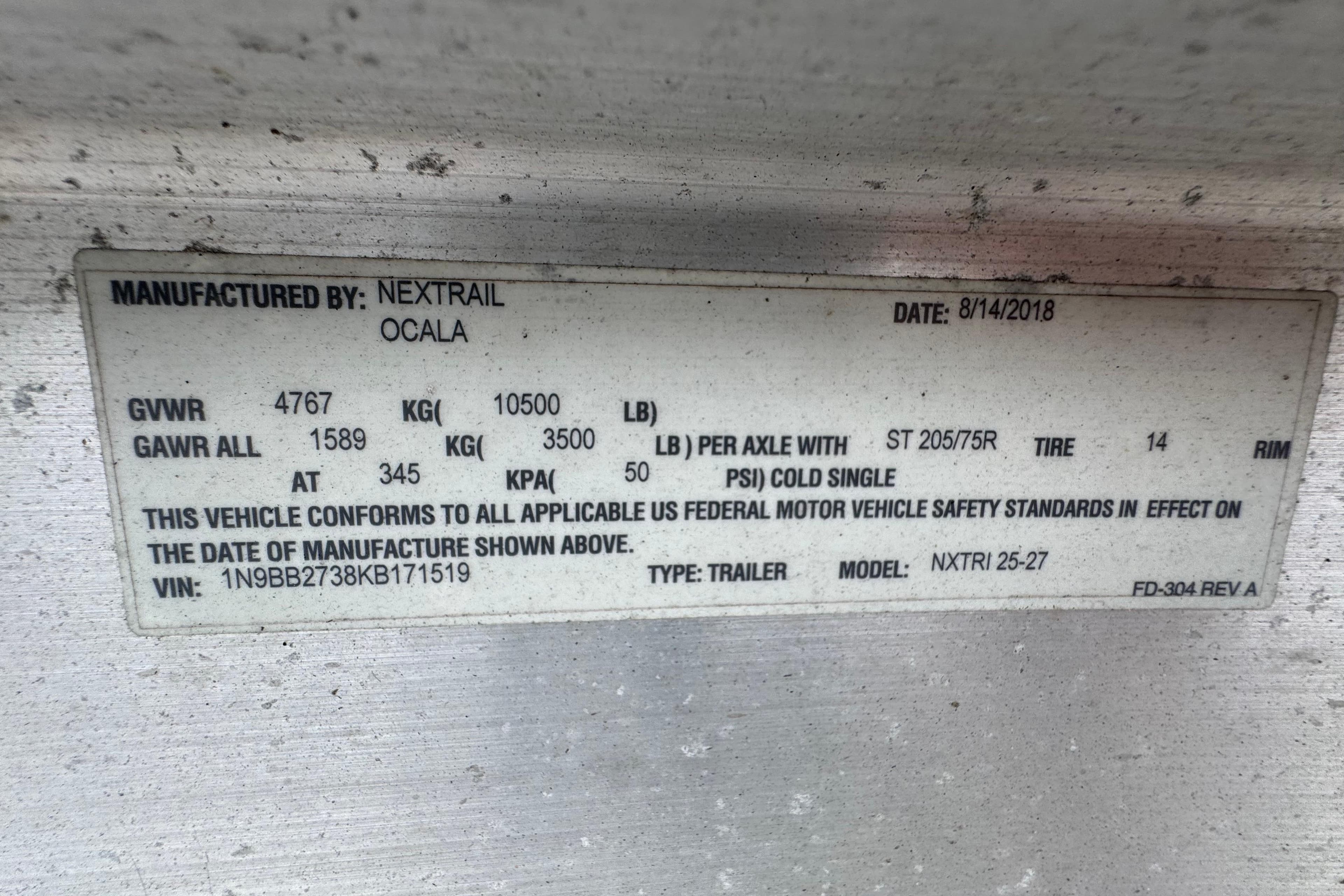 Label on trailer manufactured by Nextrail, Ocala, dated 8/14/2018, with specifications.
