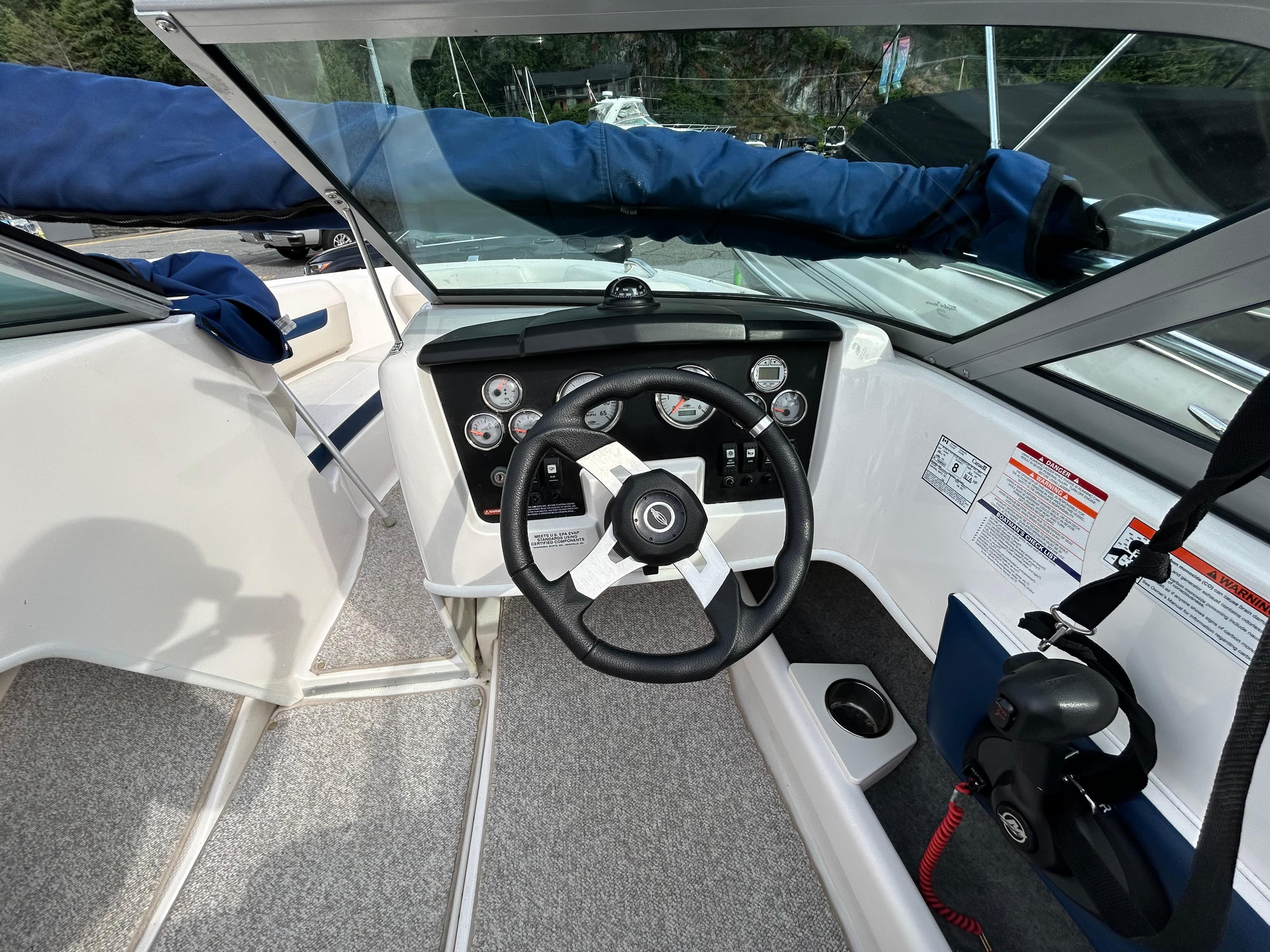 2010 Chaparral 186 SSi boat cockpit with steering wheel and instrument panel.
