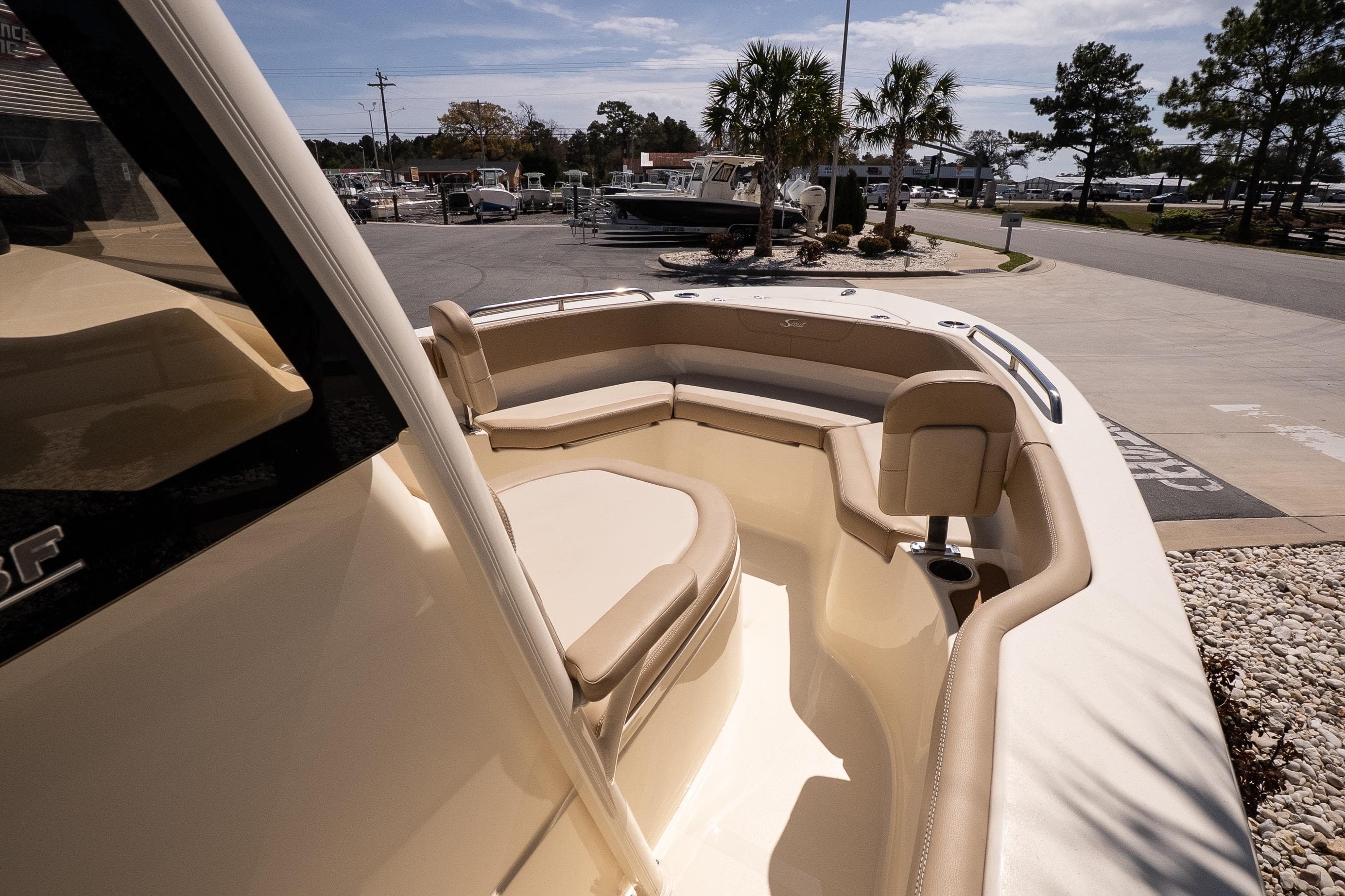 2026 Scout 215 XSF boat interior with beige seating and cup holders.