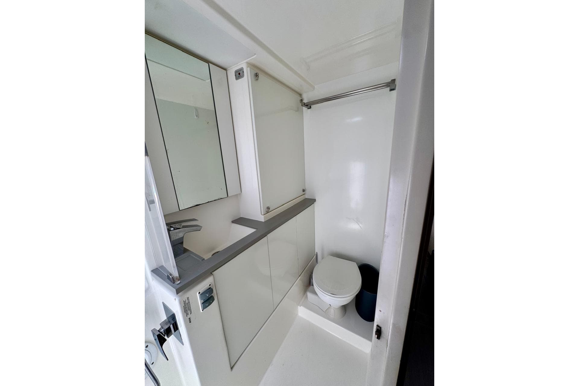 Modern bathroom in a 2017 Leopard 45 yacht, featuring sleek fixtures and compact design.