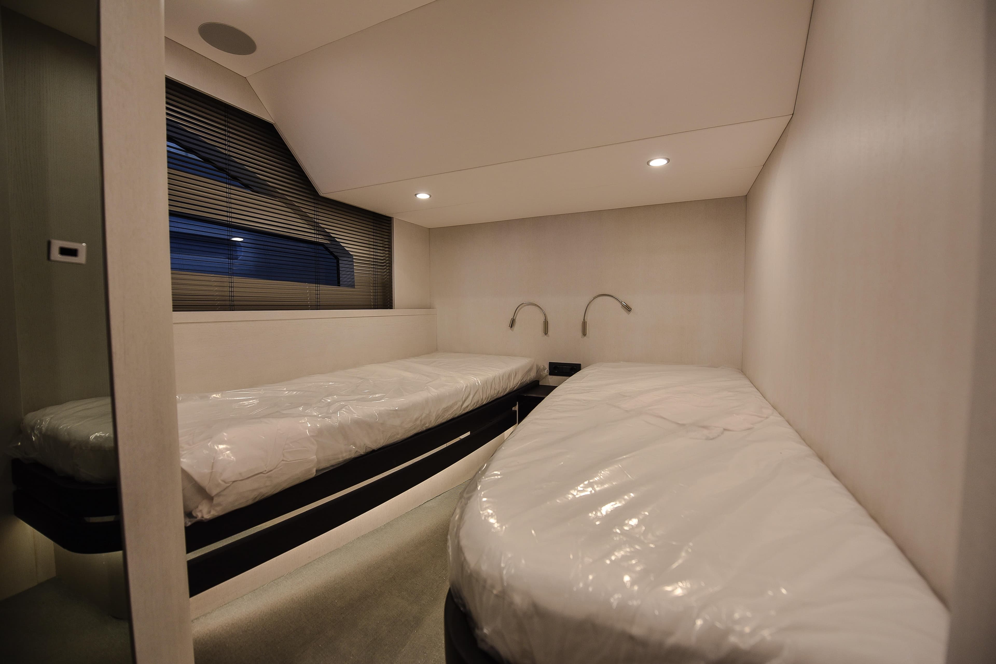 Modern twin cabin interior of 2026 Van der Valk Beach Club 600 yacht.