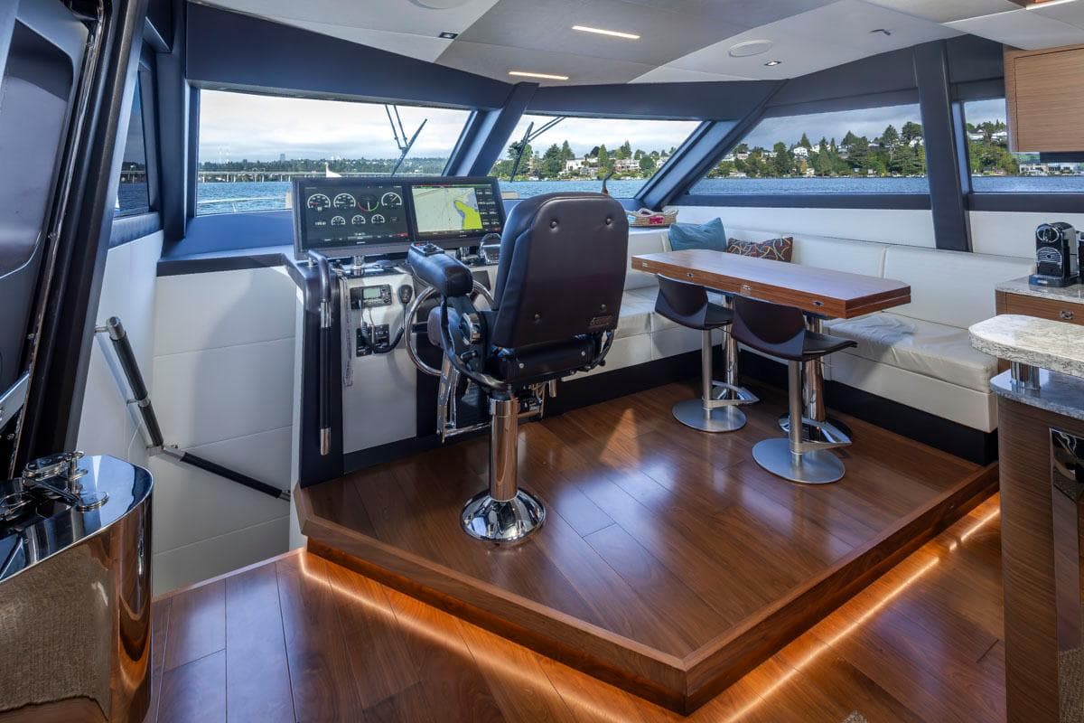 Luxurious interior of 2017 Ocean Alexander 70E Motoryacht with helm and seating area.