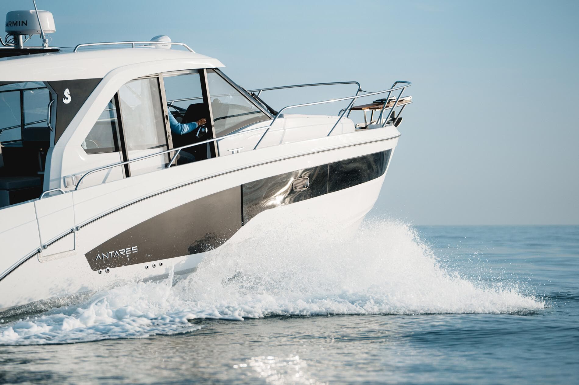 2025 Beneteau Antares 9 cruising on open water, showcasing sleek design and performance.